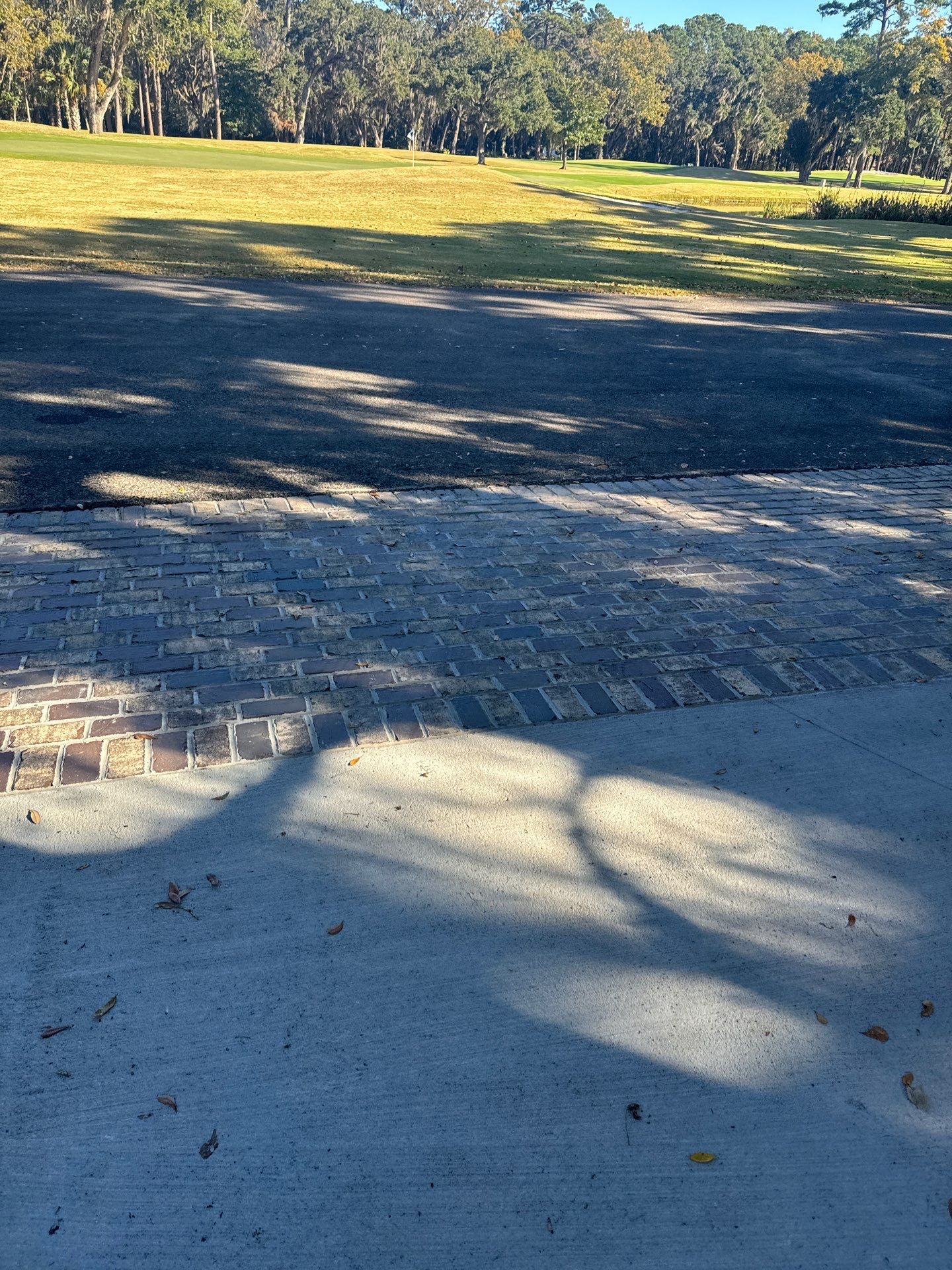 Custom Concrete Driveway Installation with Decorative Brick Borders in Okatie by Lowcountry Scapes, LLC