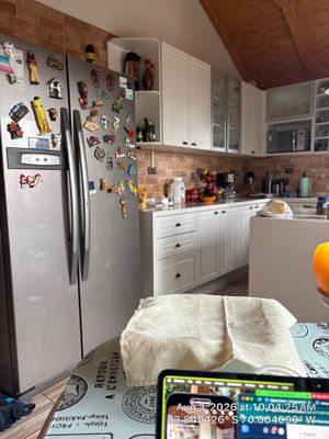 Modern Kitchen Remodel Featuring Vaulted Ceilings and White Shaker Cabinetry