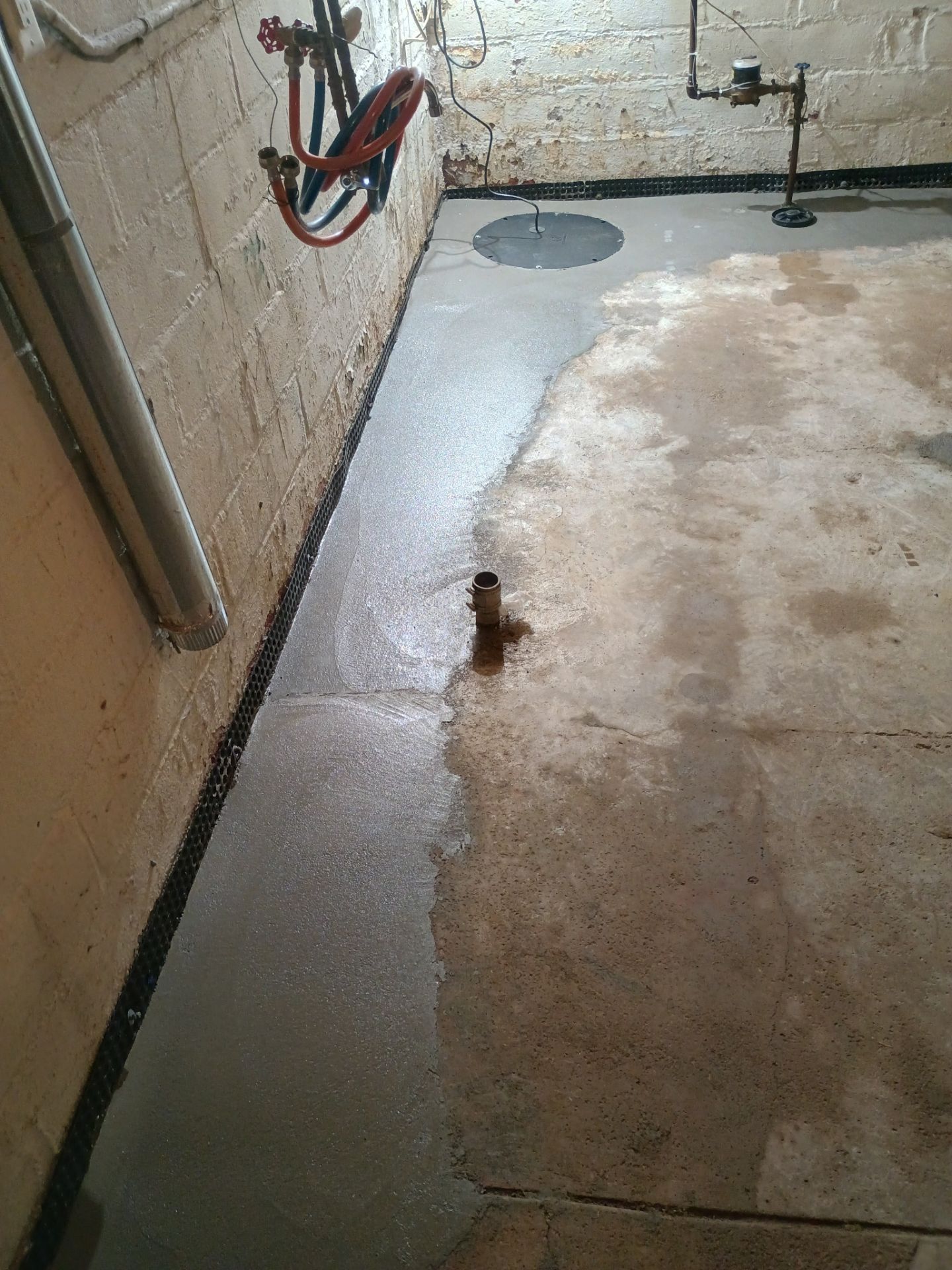 Interior Drain Tile & Sump Pump System in North Minneapolis by Waterproofing Northeast