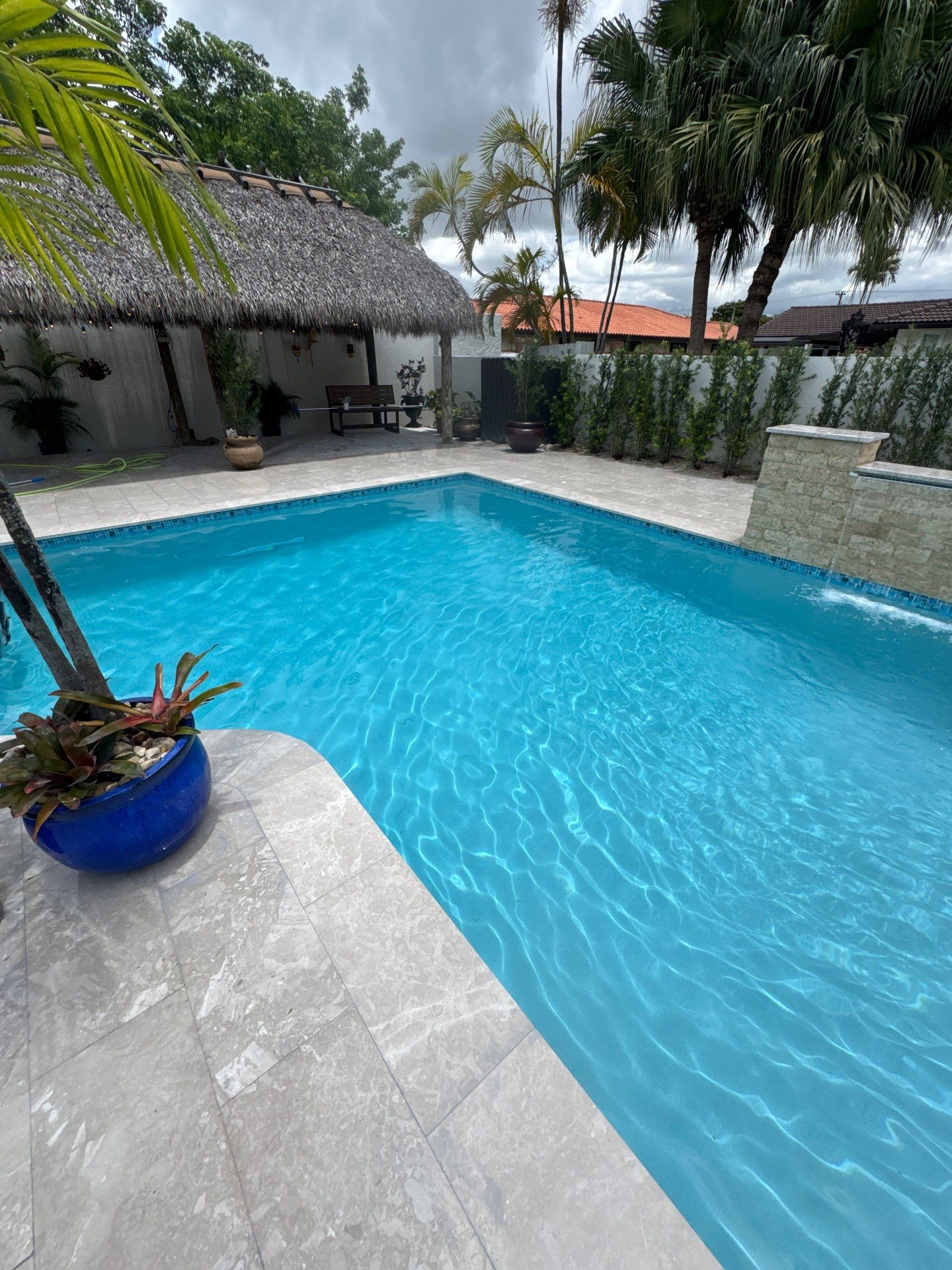 Watefall and bench addition by Pristine Pools Miami