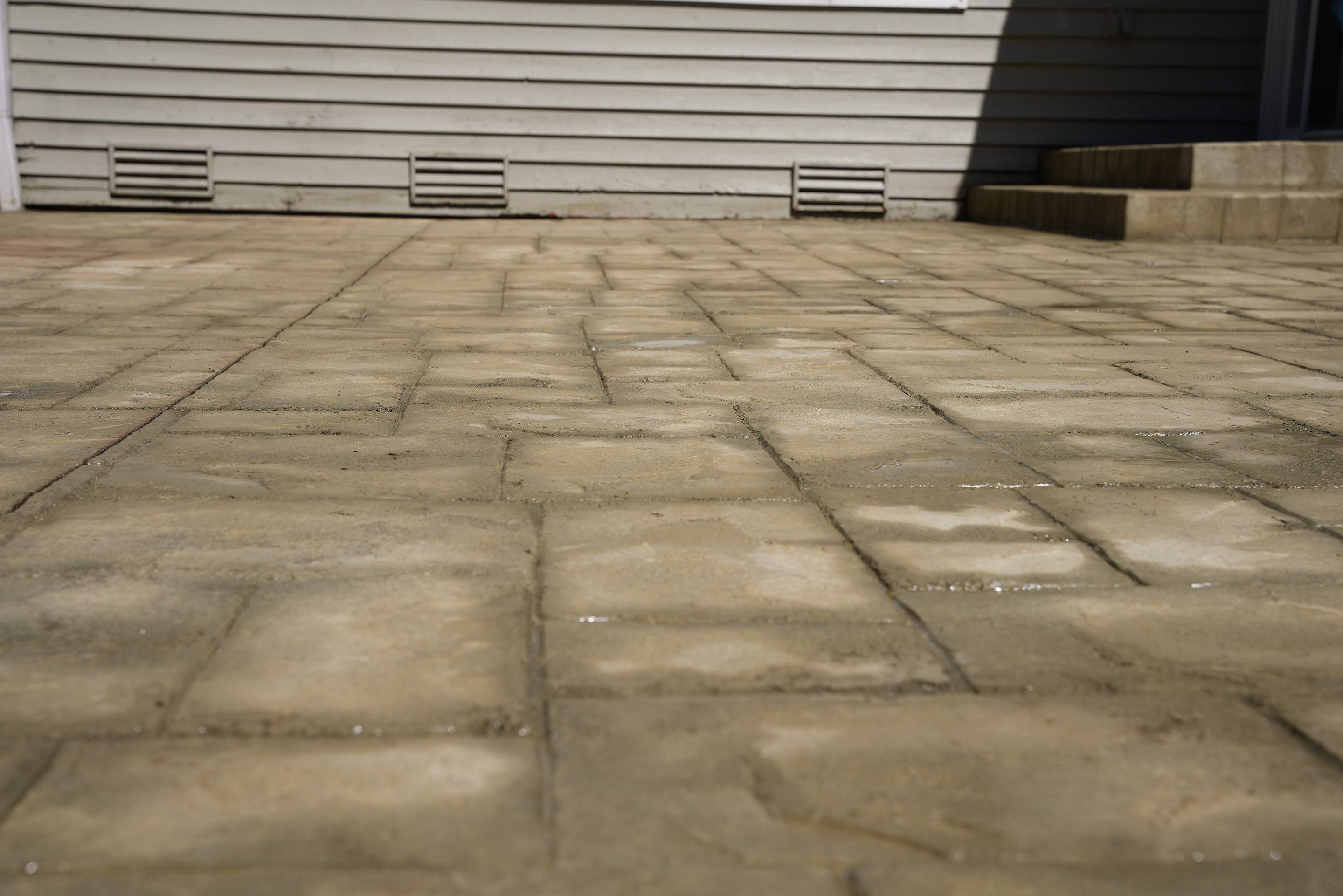Benedict | Stamped Concrete Back Patio by Jireh Asphalt & Concrete Inc 