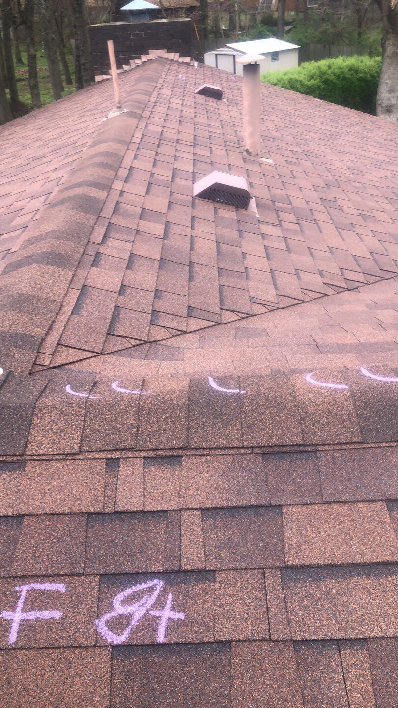 roof inspection in Harrah by McCann's Roofing and Construction