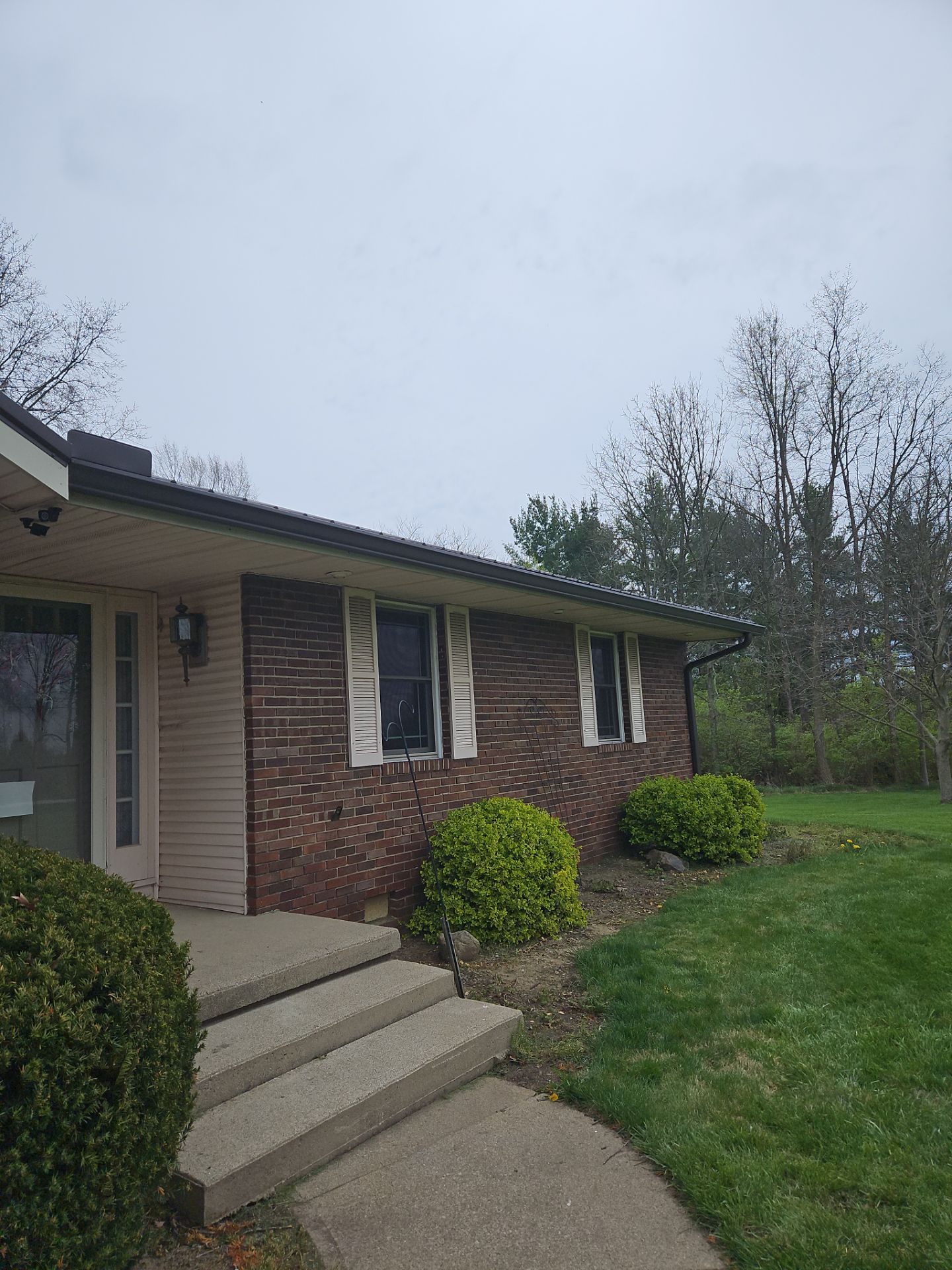 Residential Roofing Installation using Performance Panel Metal - Crinkle Bronze by RoofX 