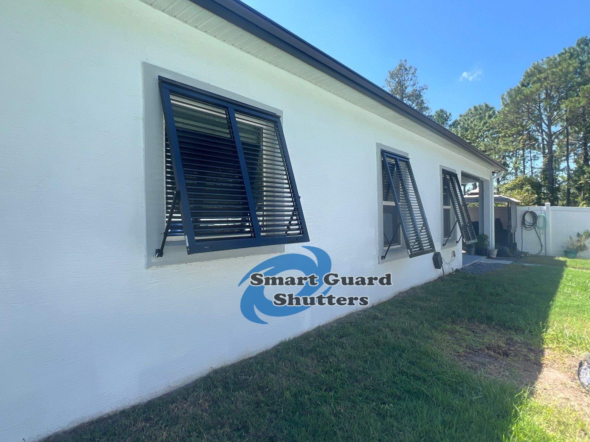 Impact Bahama Shutters in Jet Black by Smart Guard Shutters