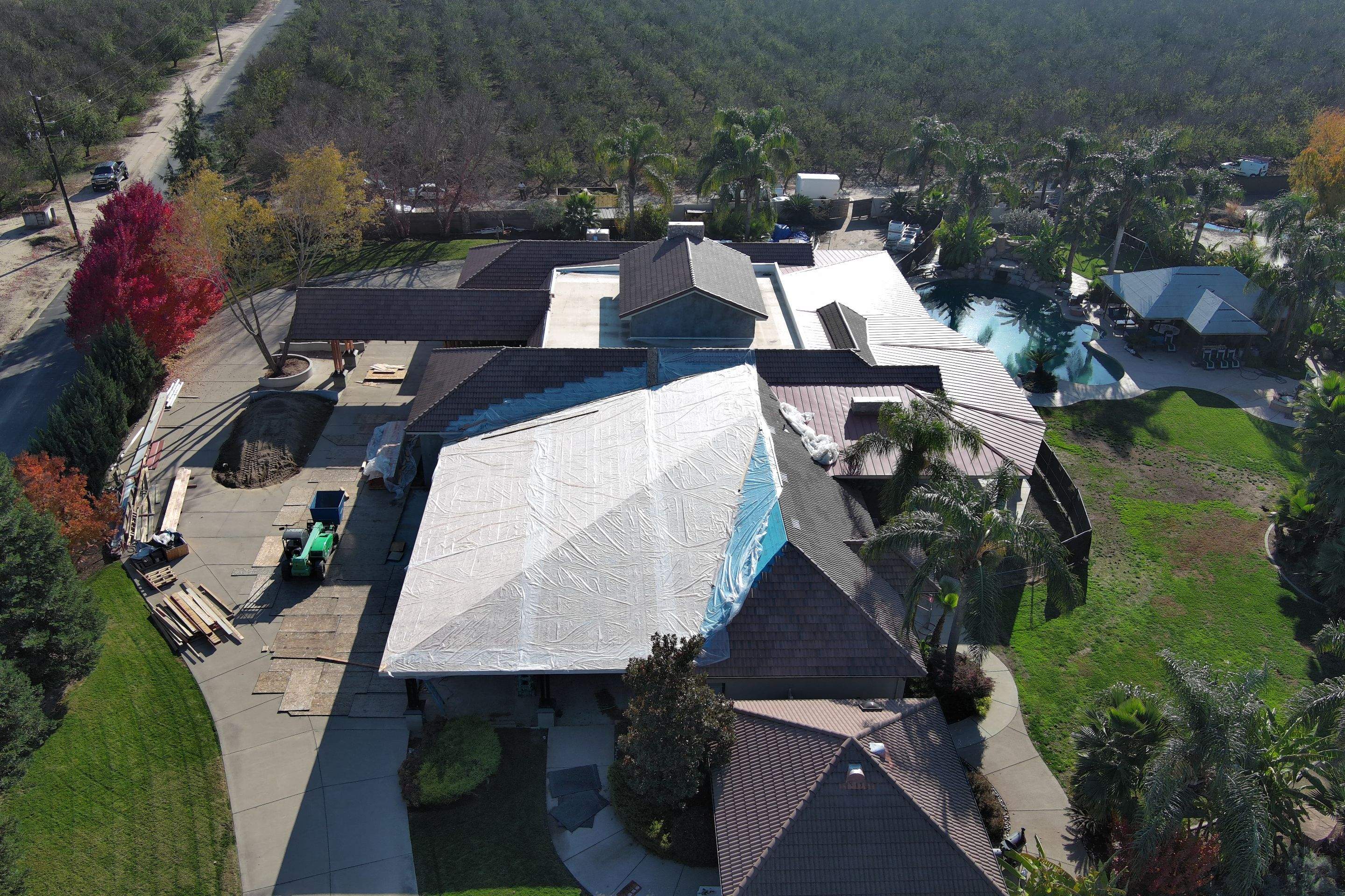 Tile, Metal, and TPO roofing project (new construction) by Straight Edge Roofing Inc