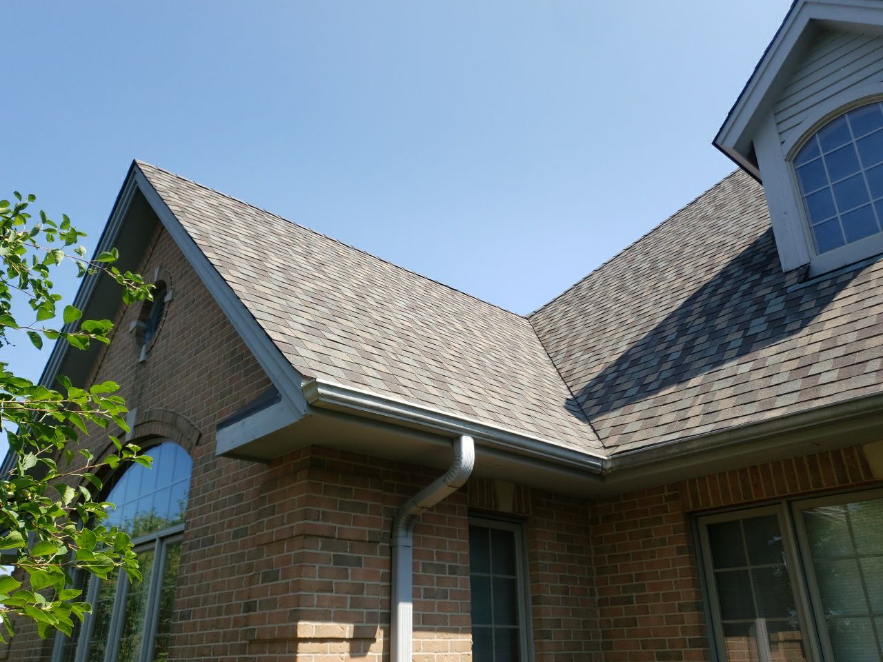 Asphalt Roof Replacement and Aluminum Gutter Installment  by Custom Installations, Inc.
