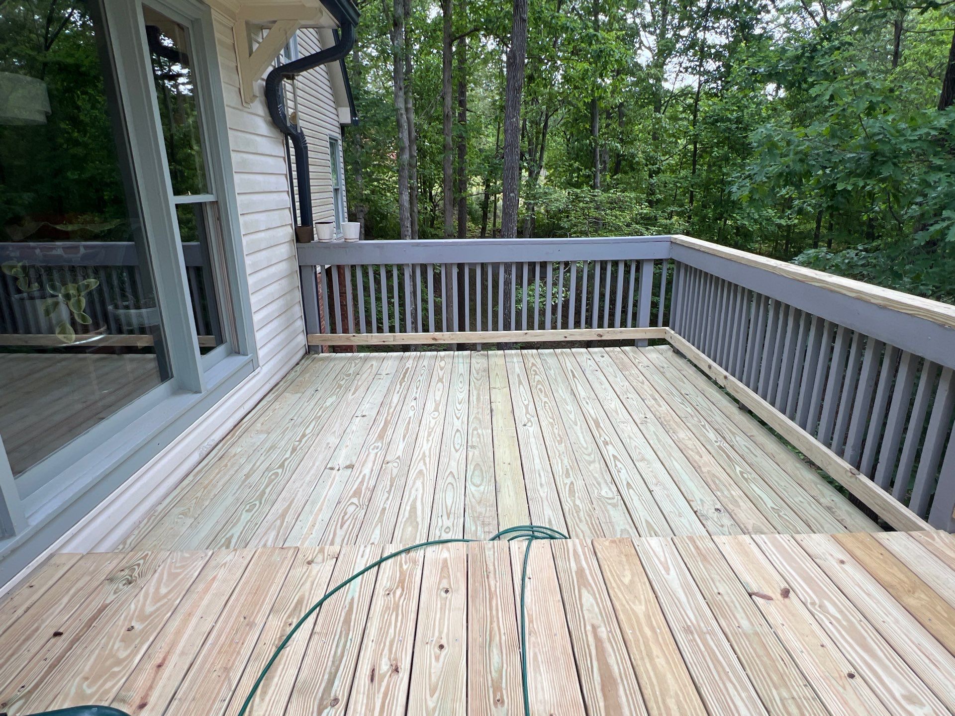 Pressure-Treated Wood Deck Resurfacing and Staircase Reconstruction in Canton by Swift Home Renovations
