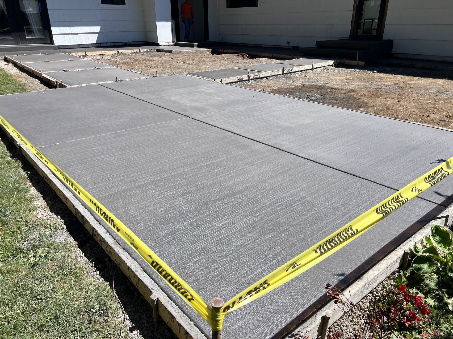 John | Concrete Backyard Walkway by Jireh Asphalt & Concrete Inc 