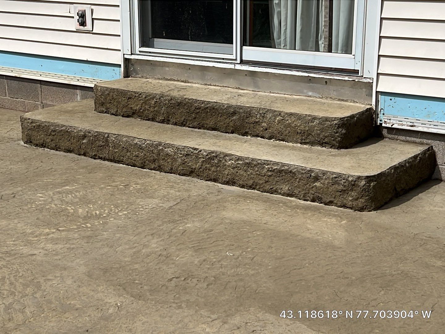 Bluestone textured stamped concrete patio by NG Masonry & Construction LLC