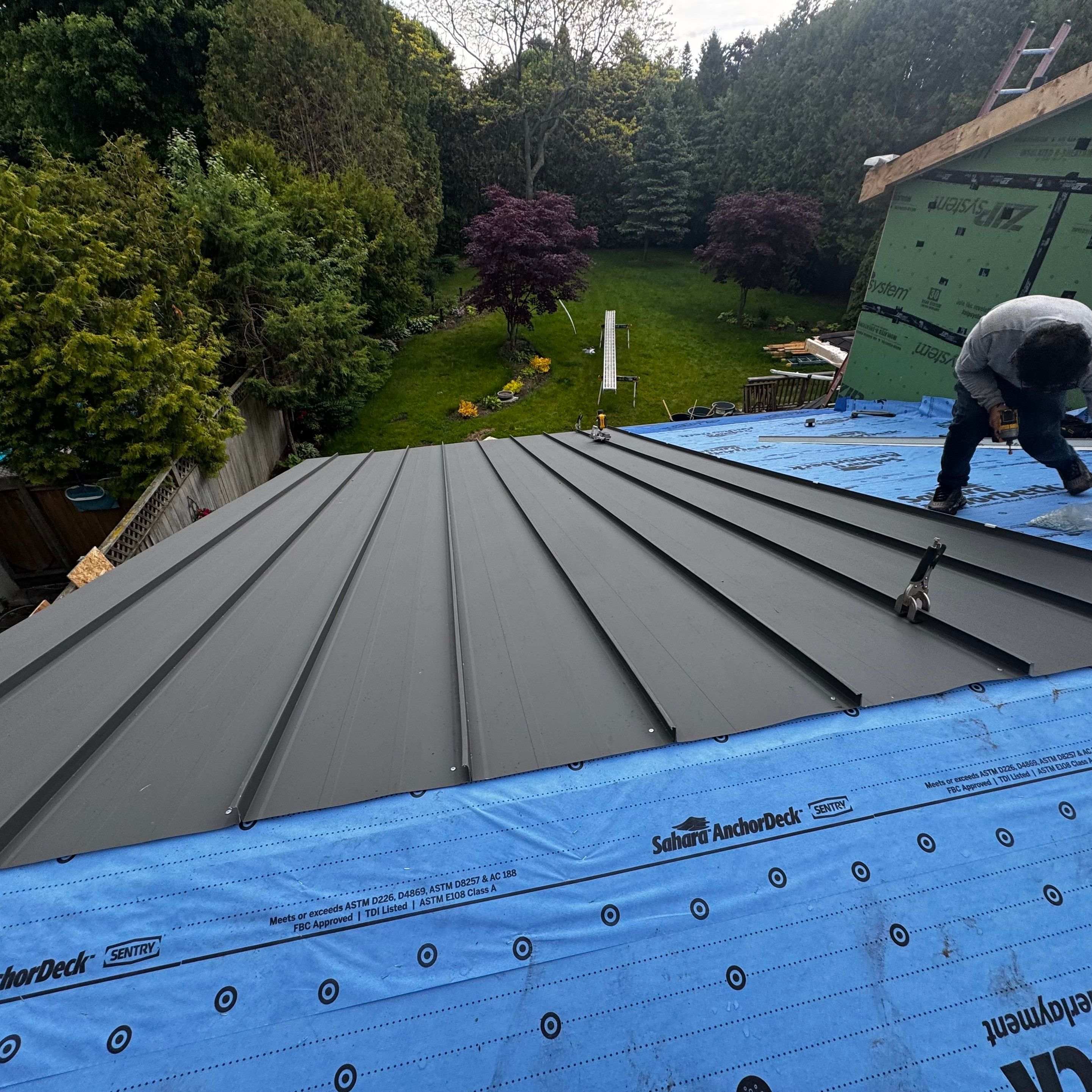 Residential Roofing Installation using 16" Standing Seam Panels by Jay Carter Roofing & Sheet Metal