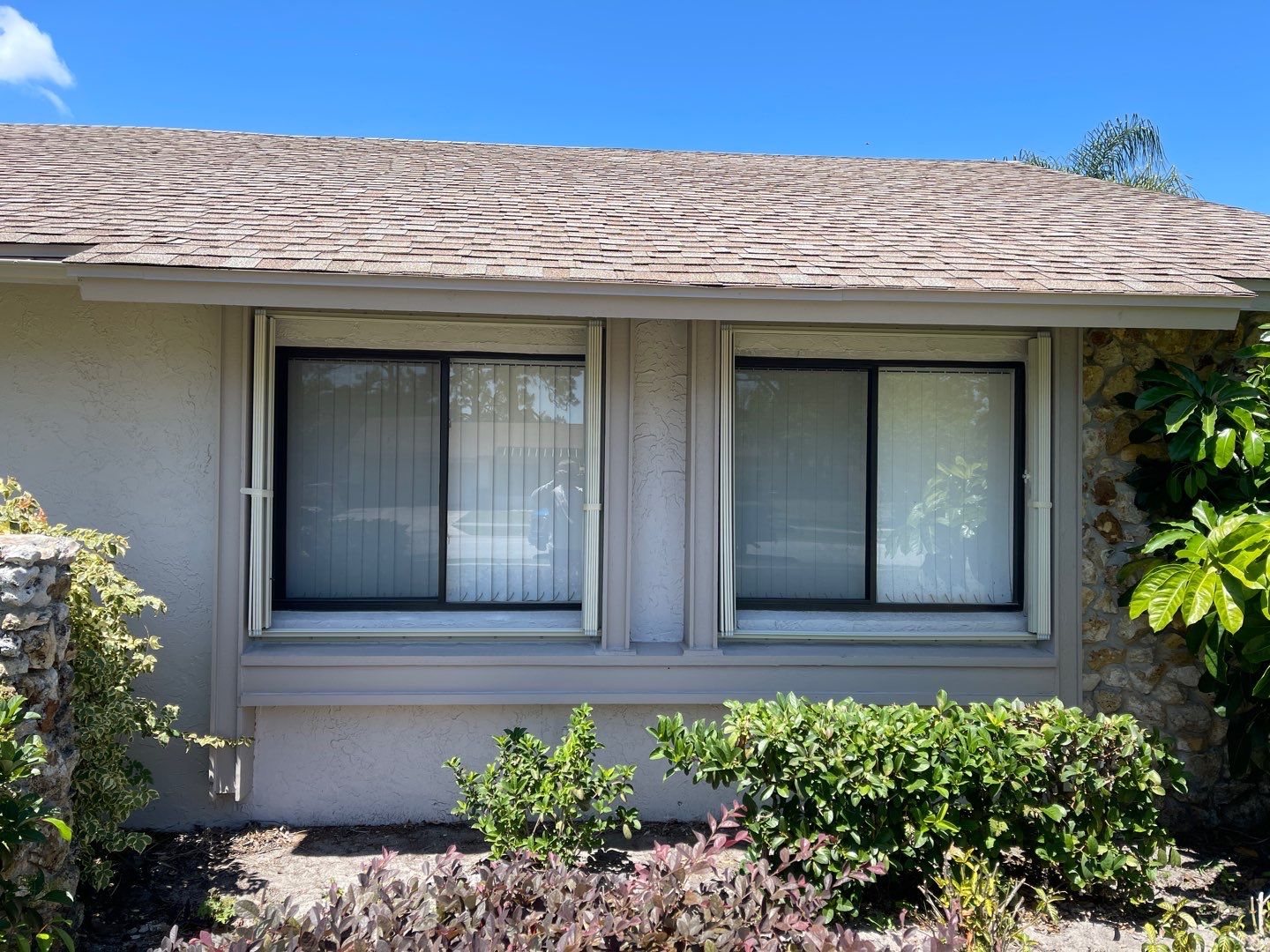 Ivory accordion shutters by Smart Guard Shutters