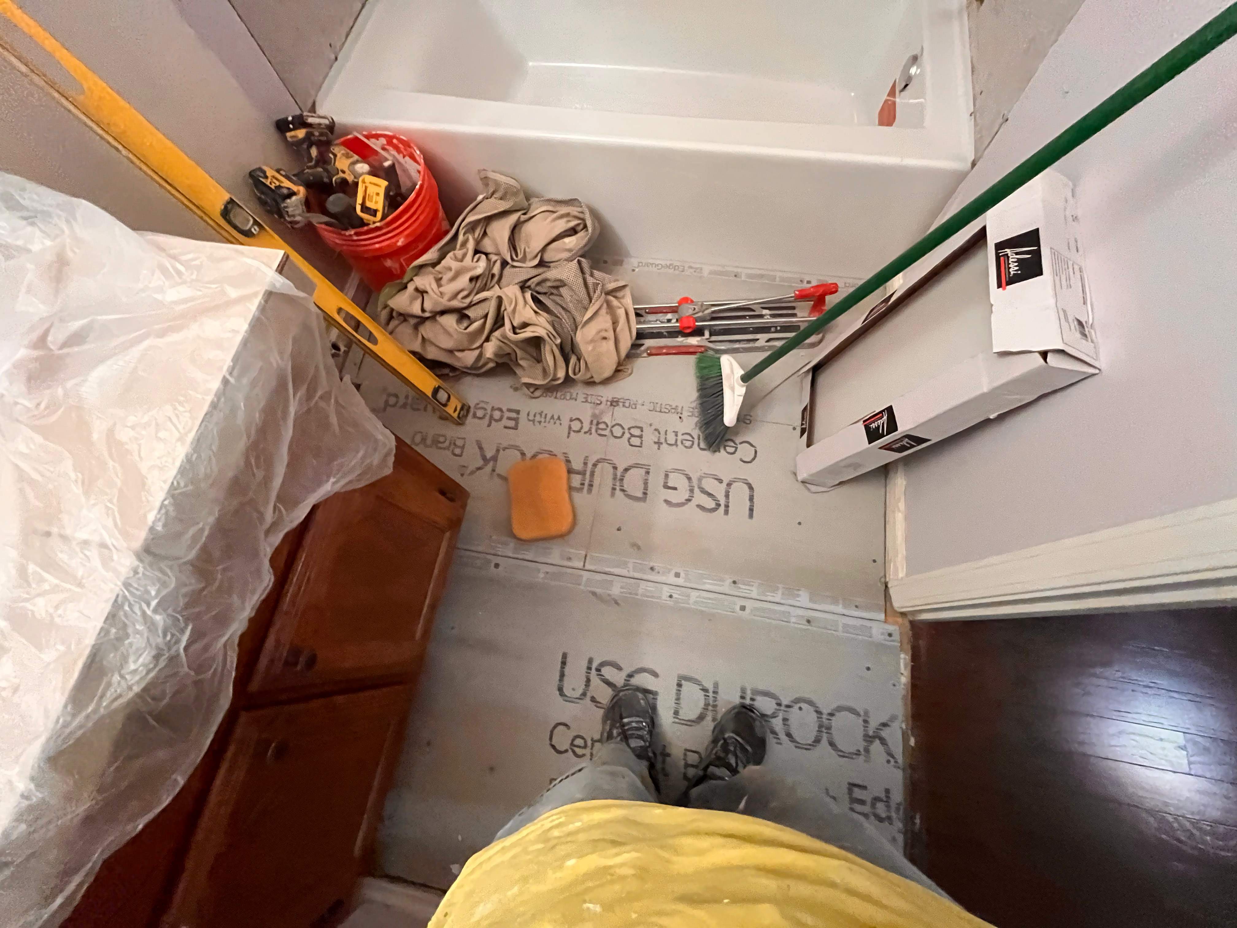 Guest bathroom tub and flooring by Prudencio