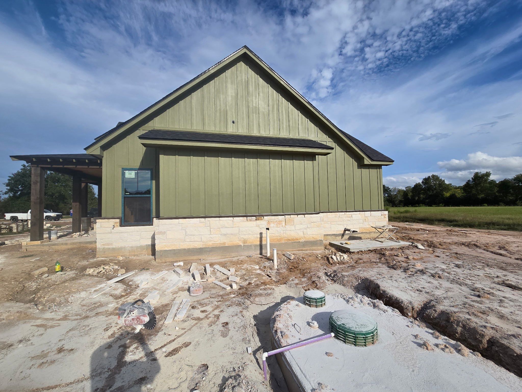 Cleveland Ranch Charm: Natural Stone Wainscot with Green Accent Siding. by Apex Conventional Stucco Llc