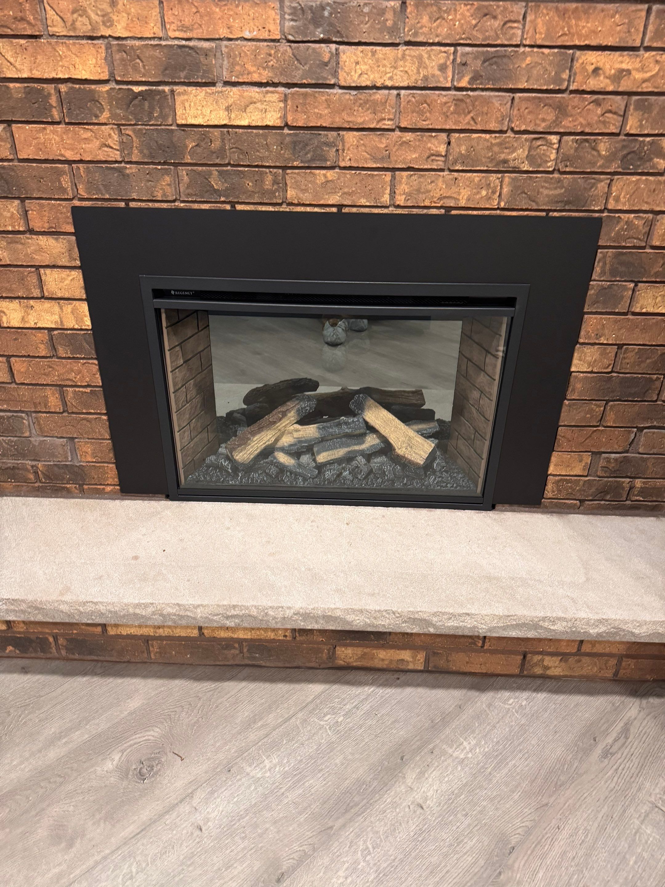 Electric Fireplace and Limestone Hearth & Mantel Installation by Leonard and Sons Building Services, Inc.