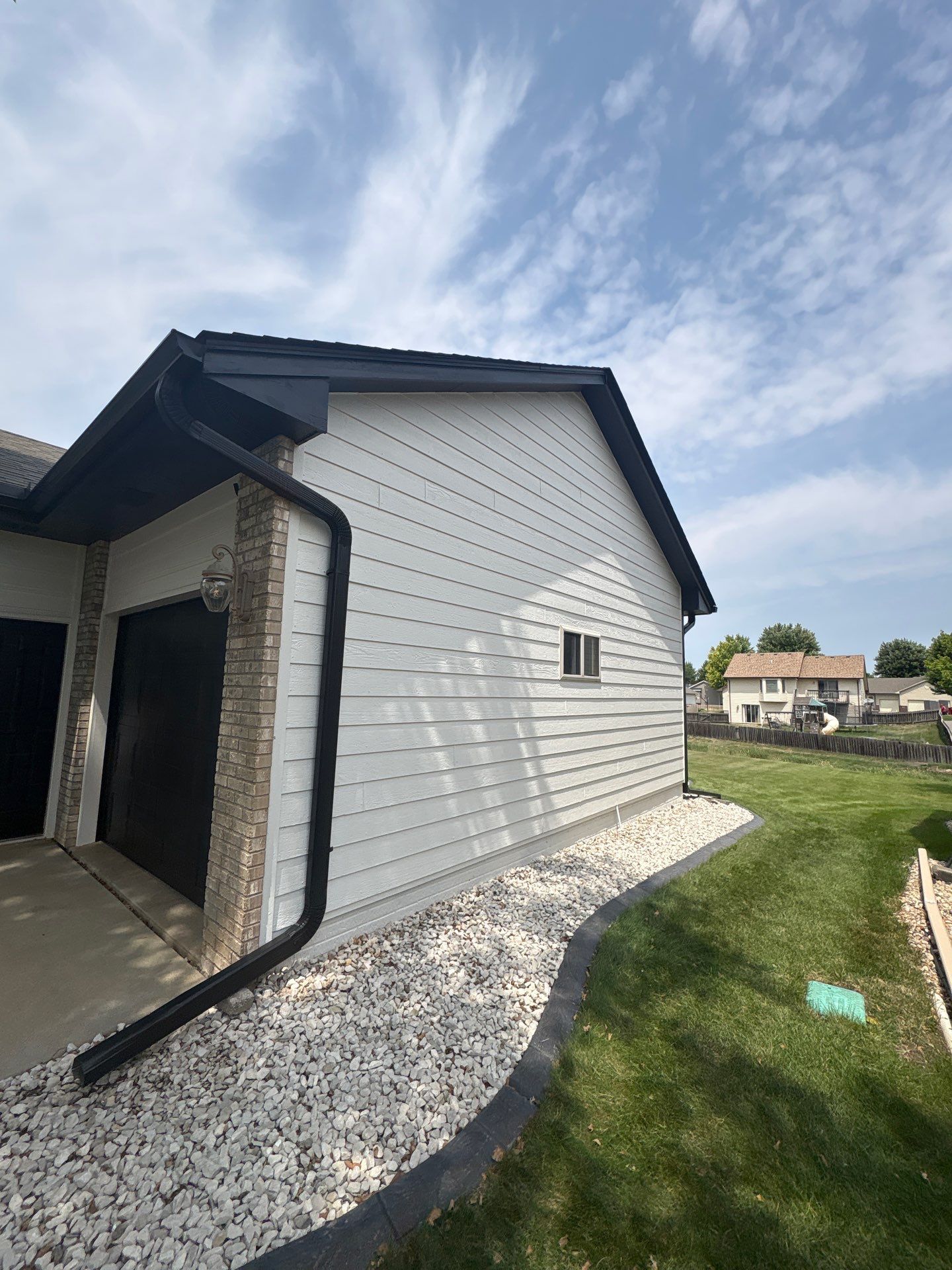 Residential Exterior Painting and Siding Refresh in Sioux Falls by Select Painting, Coatings & Garage Cabinets