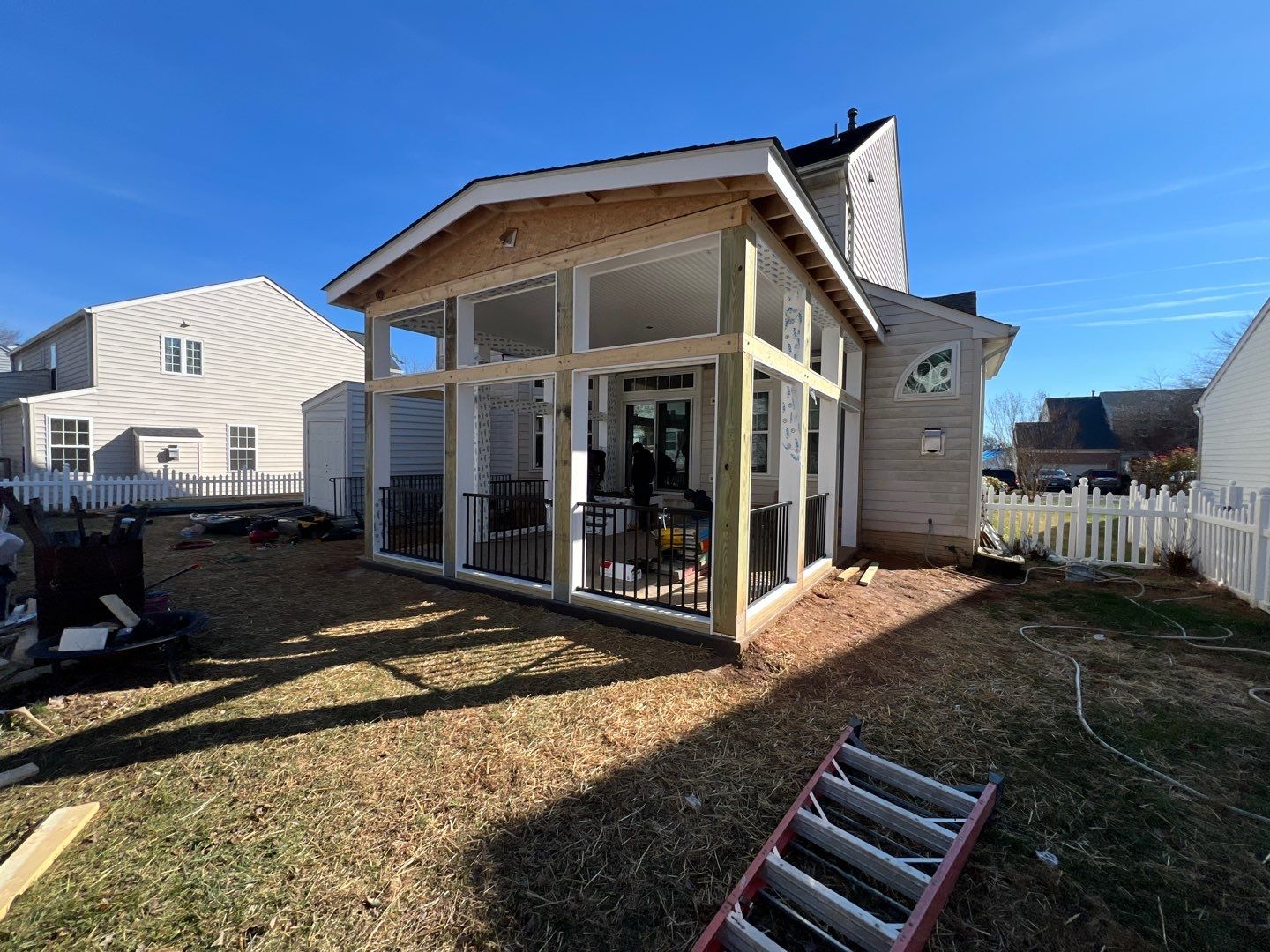 Custom Screened-In Porch with Stamped Concrete Patio in Warrenton by Jakari Restoration & Construction LLC