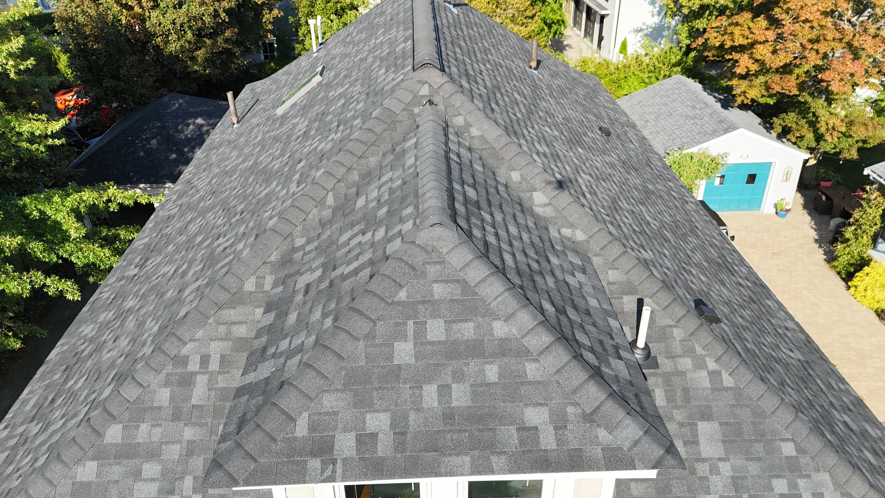 Roof Replacement with Skylight Flashing in Waltham, MA by Mighty Dog Roofing of Greater Middlesex County