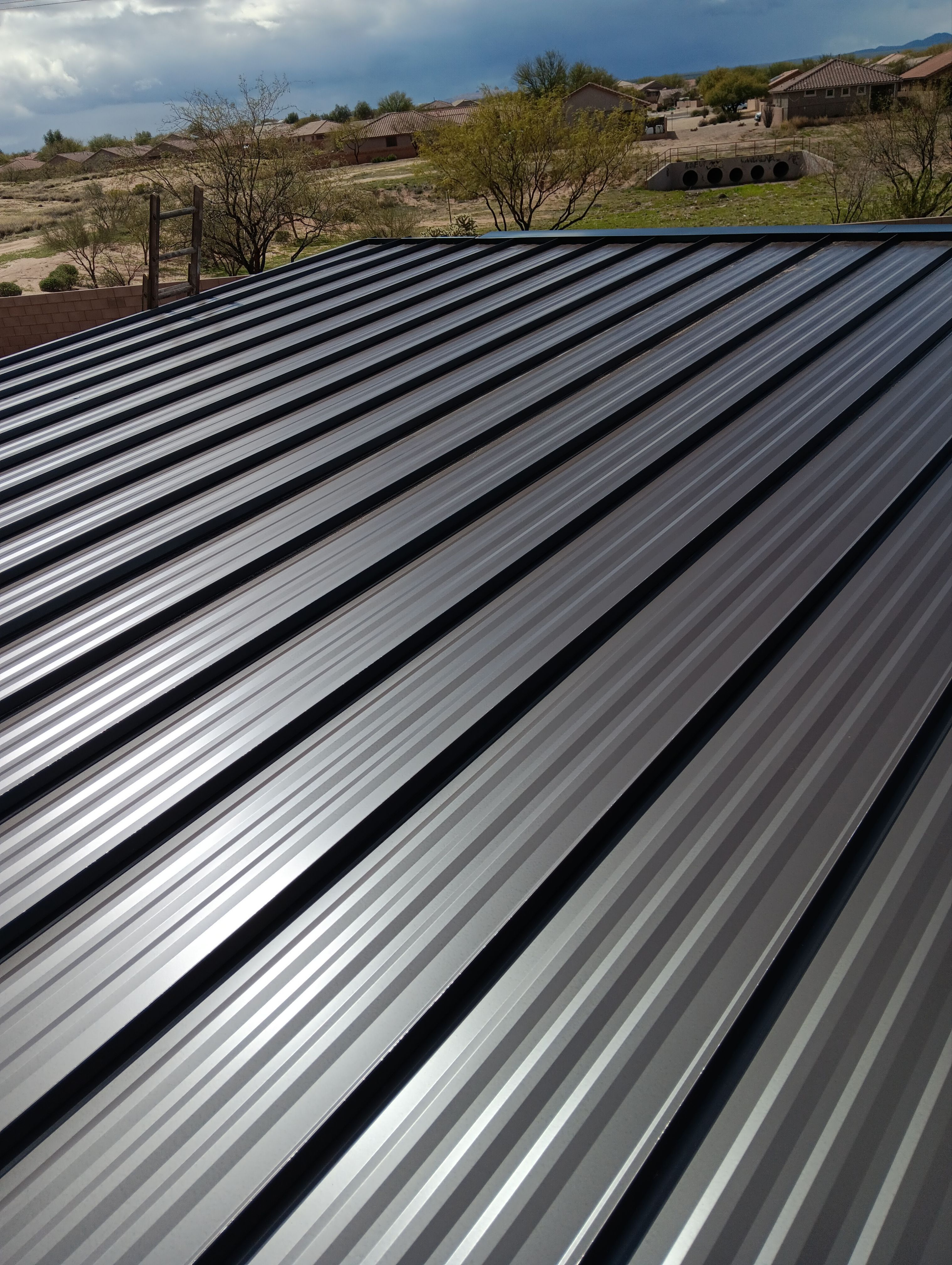 Dark Bronze Standing Seam by Reimagine Roofing