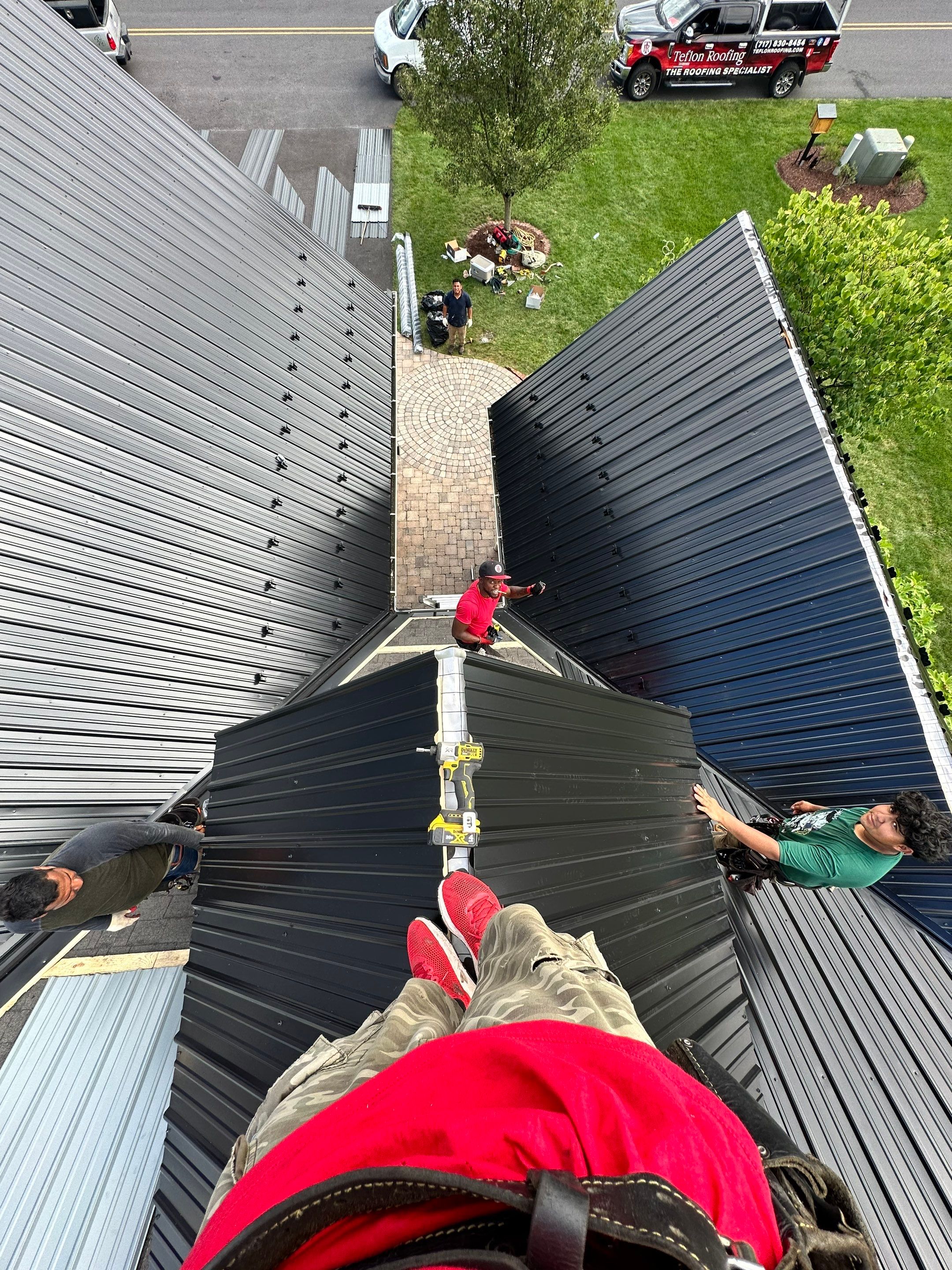 Standing seam / Azm panel in black  by Teflon Roofing