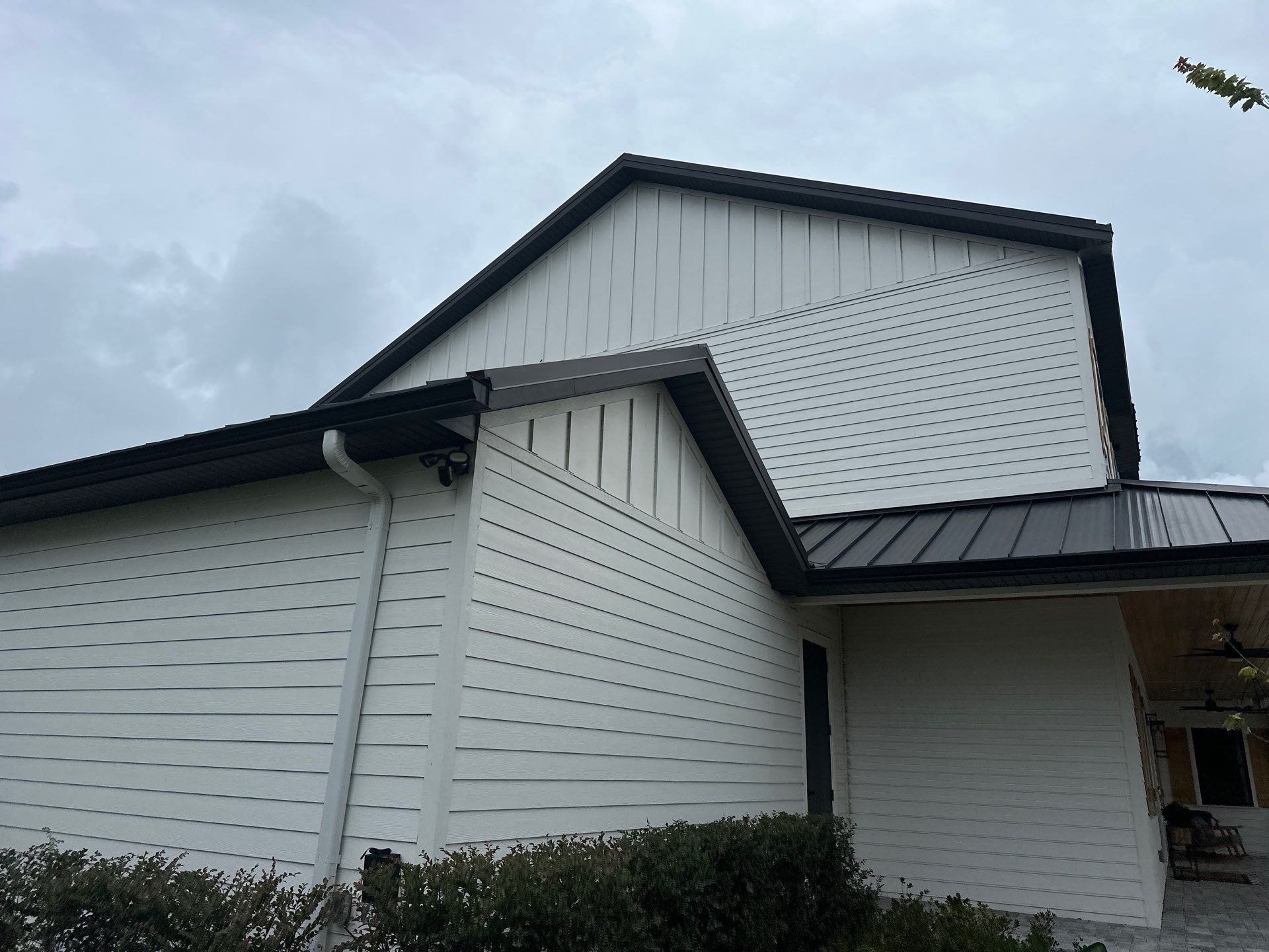 Complete Two-Story House Wash and Driveway Cleaning in Winding River Community, Bradenton, FL by Sunshine AquaWash