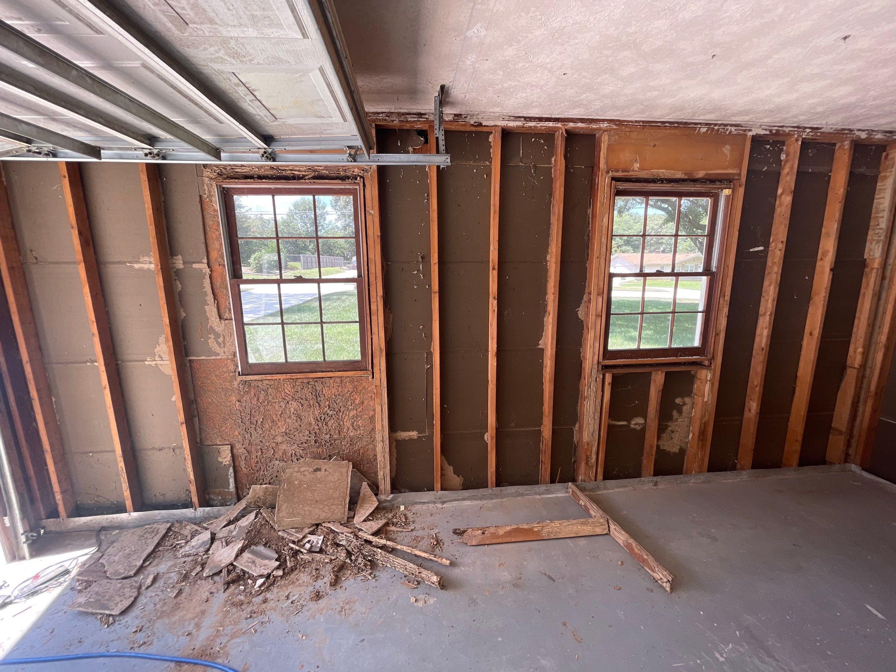 Snellville Garage Remodel Featuring Epoxy Floors and Board and Batten Siding by Swift Home Renovations