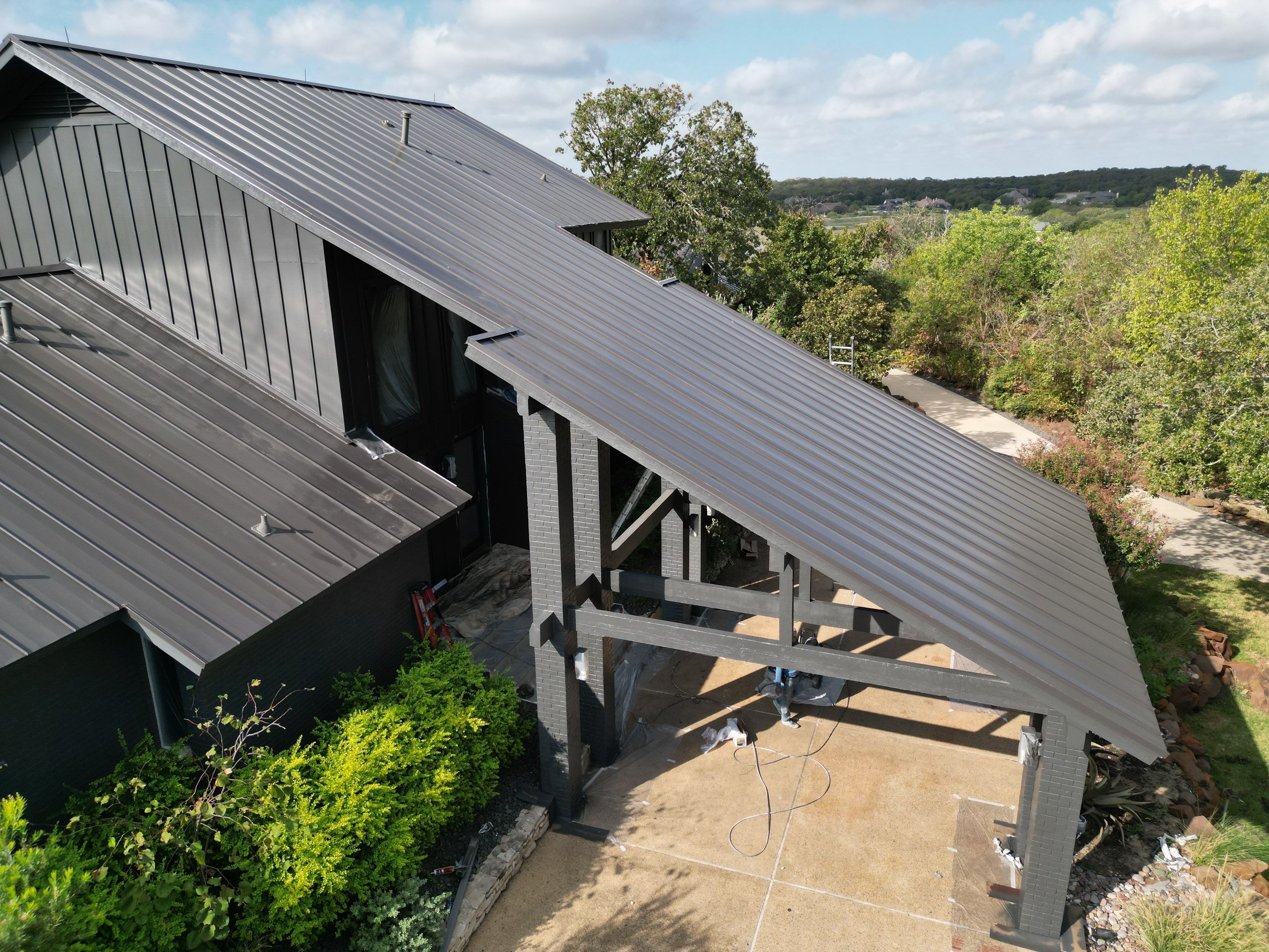 Dark Bronze Standing Seam Metal Roof by First Out Roofing 