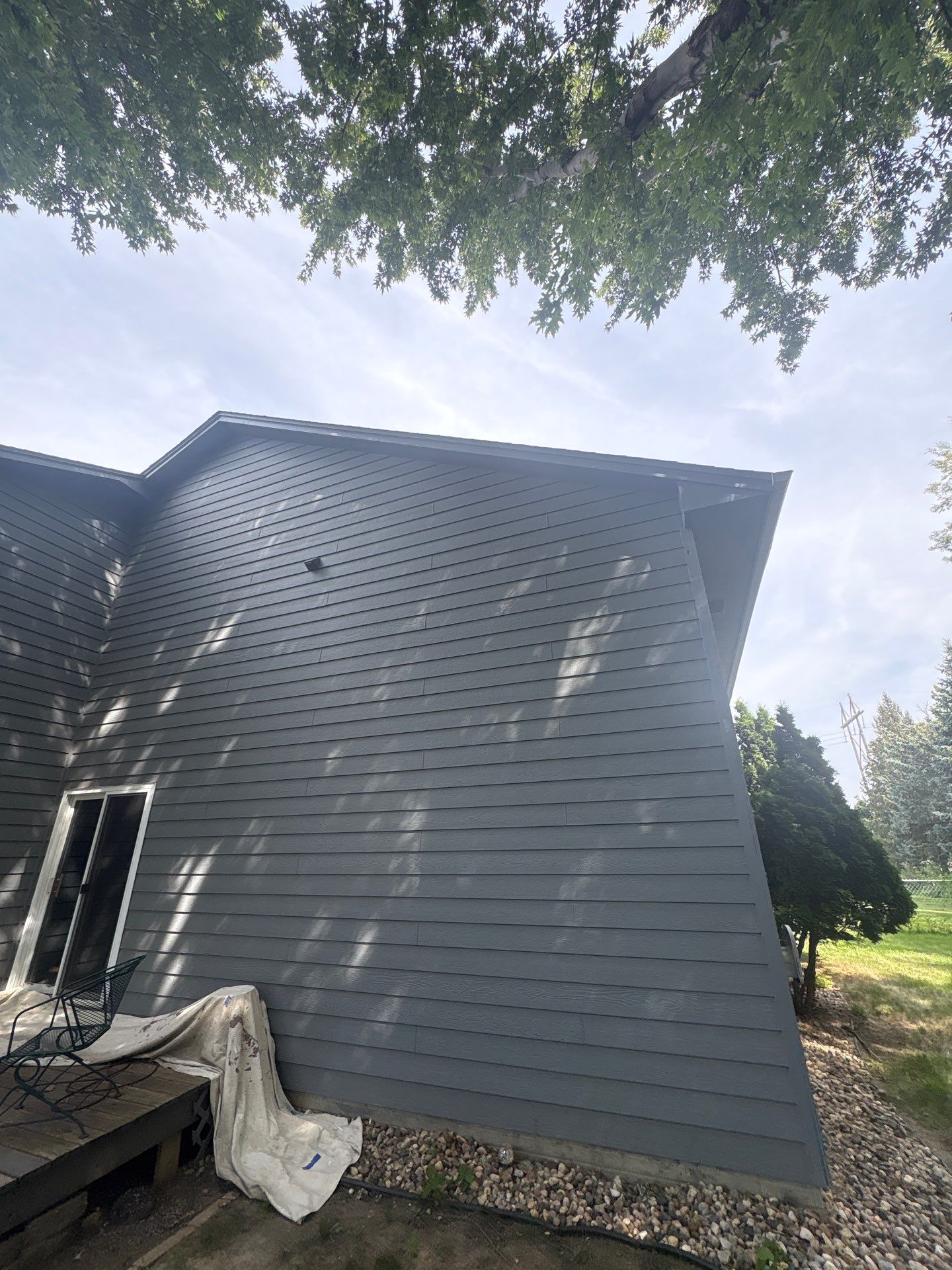 Full Exterior Painting for Gray Siding and Trim in Sioux Falls by Select Painting, Coatings & Garage Cabinets