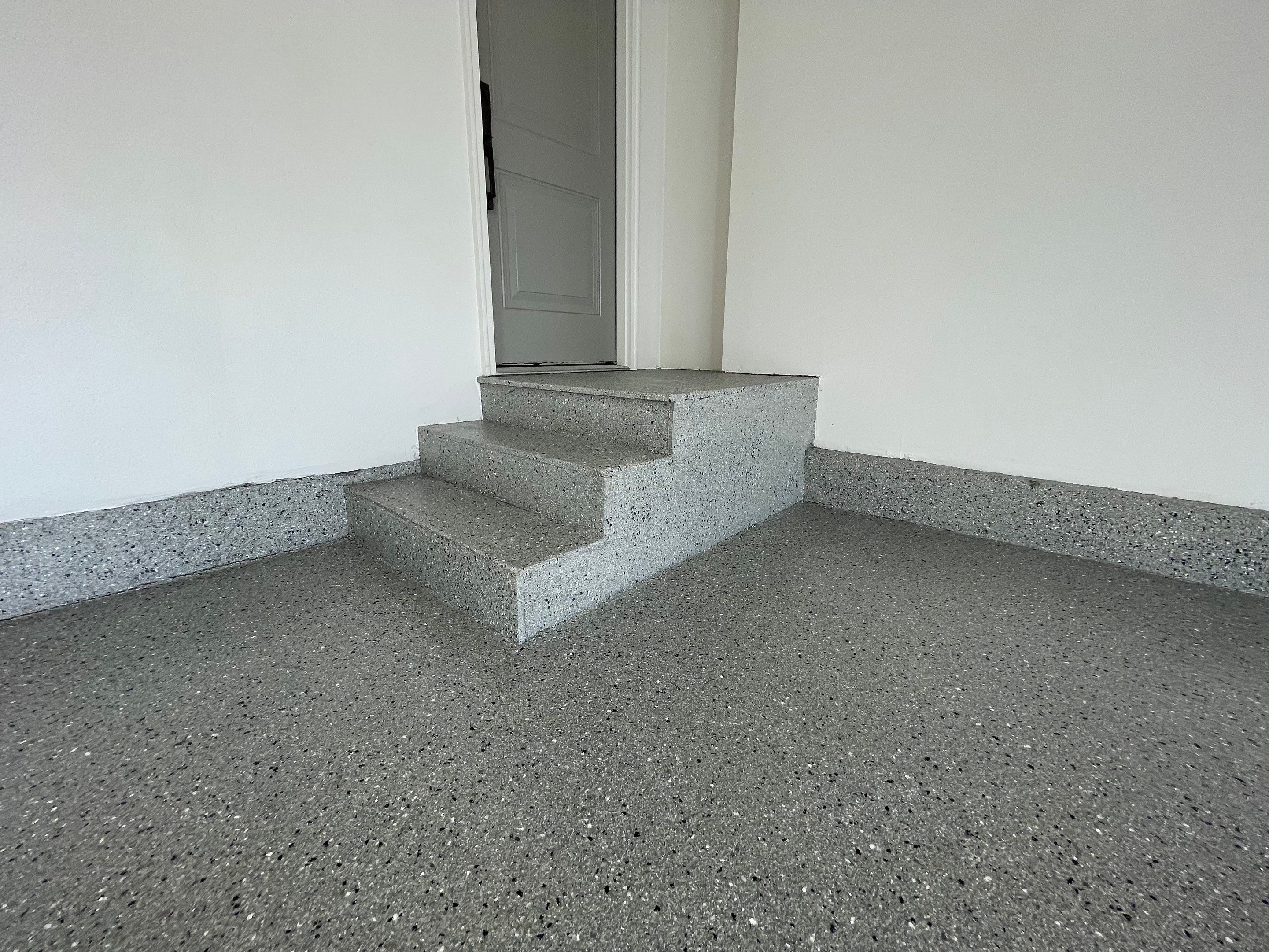 Residential Garage Floor Coating with Grey Speckled Epoxy Finish by Select Painting, Coatings & Garage Cabinets