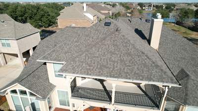 Two-Story Roof Replacement & Chimney Stucco Repair — Houston, TX