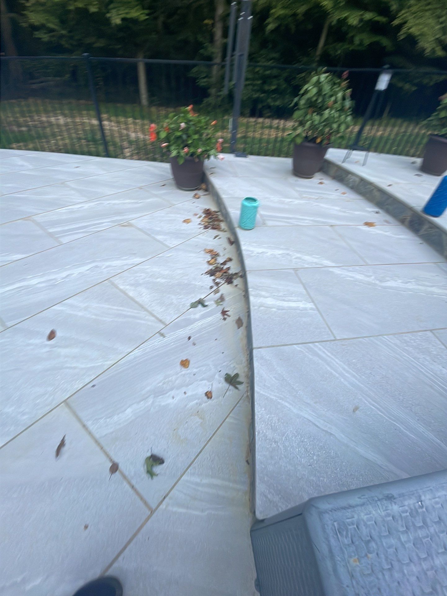 Pool Surround remodel with retaining walls, new waterfall and water slide by Fairfax Contractors, LLC