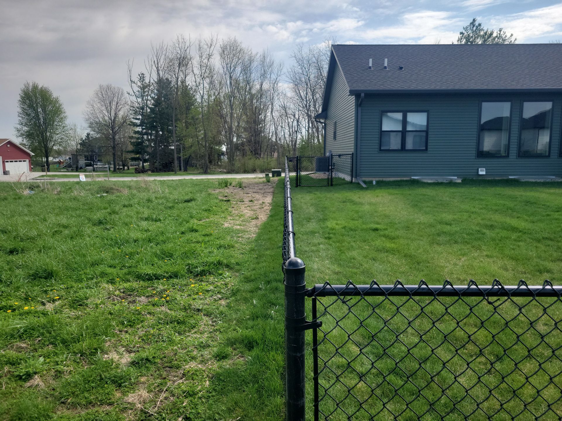 Black Chain Link Fence and Gate Installation in Cedar Falls by Perfect Picket Fence and Stain