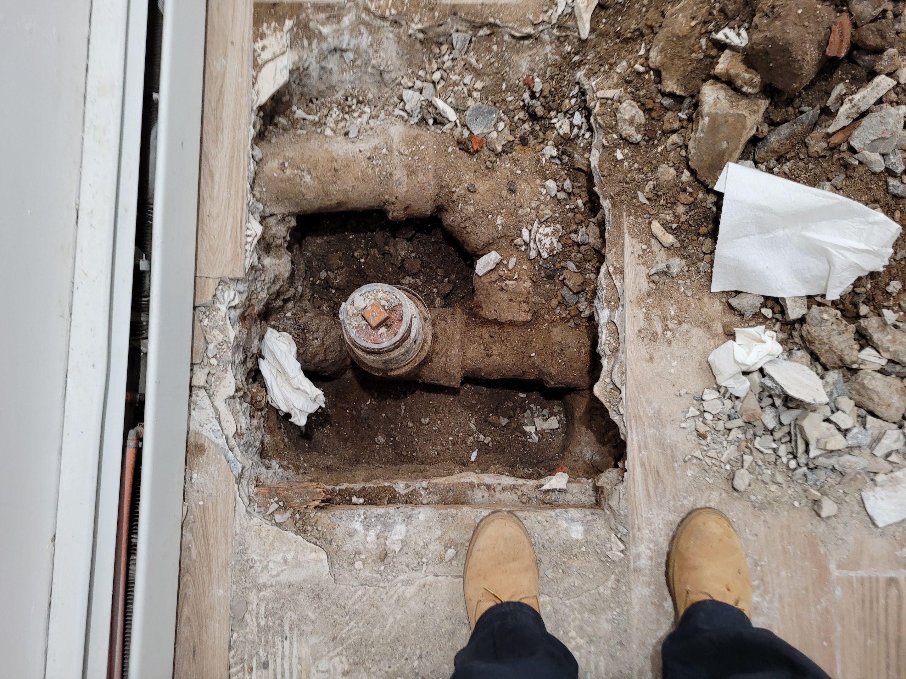 The replacement of a crumbing leaky house u-trap in basement by WG's Remodeling Inc