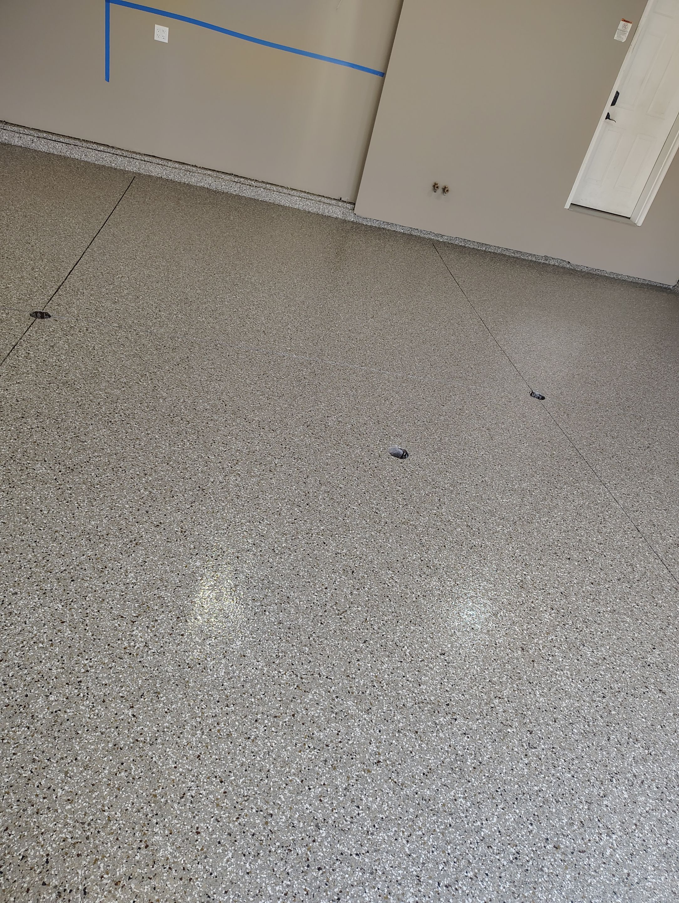 Sioux Falls Garage Concrete Repair and Epoxy Flake Floor Coating by Select Painting, Coatings & Garage Cabinets