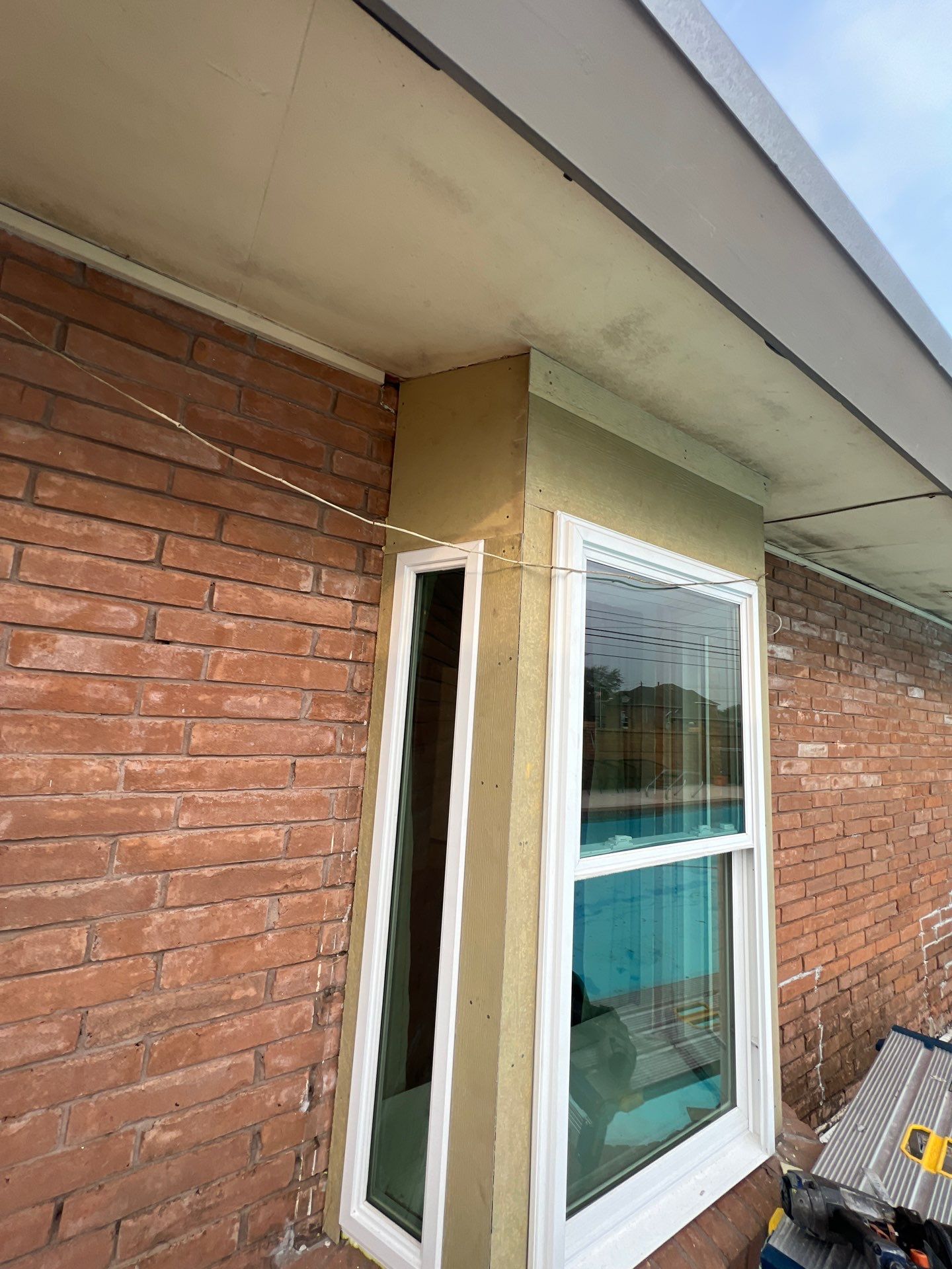Windows in Brick with a Bay Window by Bayfront Roofing and Construction