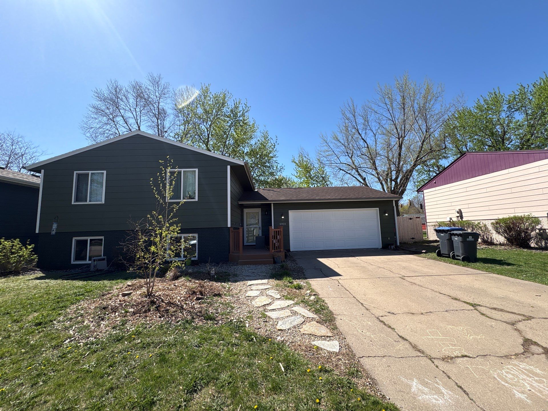Full Exterior House Painting and Foundation Refinishing in Sioux Falls by Select Painting, Coatings & Garage Cabinets