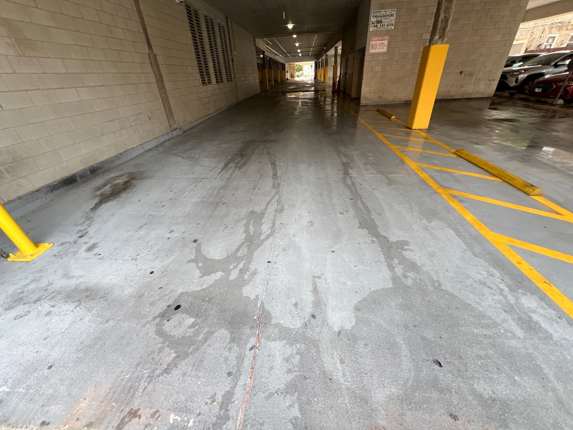 Parking garage using Hot water by Northern Power Washing LLC.