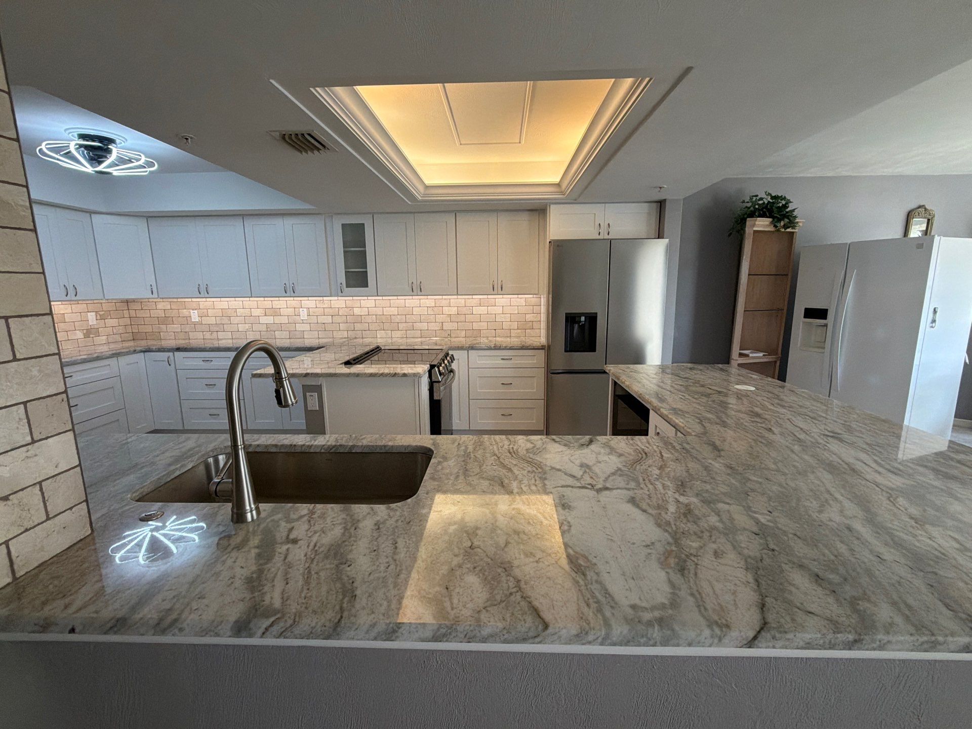 Completely Re-imagined Modern Condominium Kitchen Remodel  by Acies Renovations