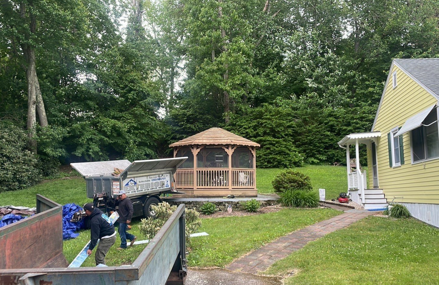Residential Roofing Installation using Copper Penny Metal Roof by A Plus Exterior