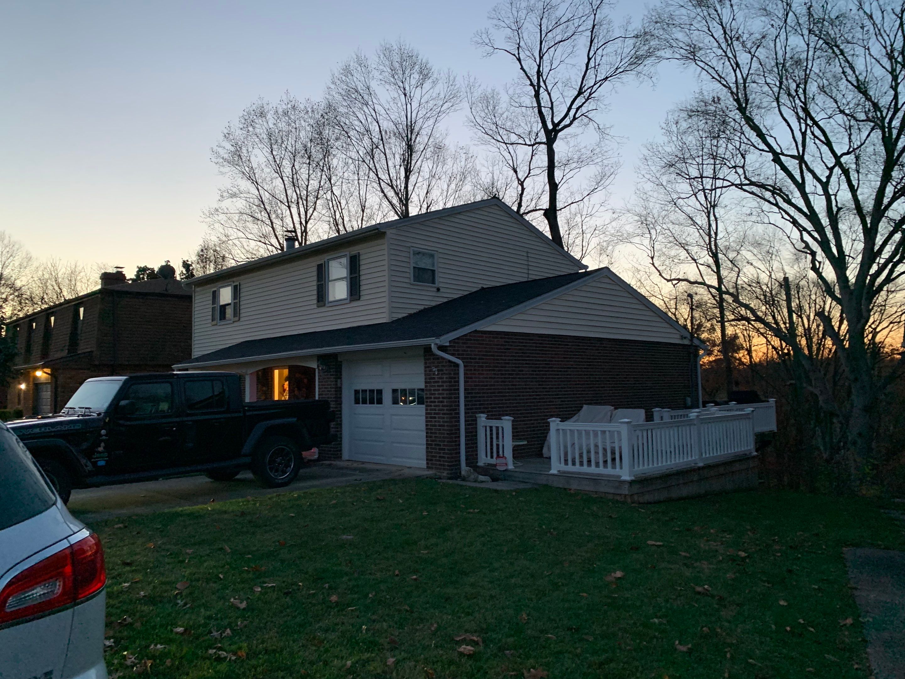Replace dated vinyl siding with new white exterior Portfolio vinyl siding  by Secure Construction Company Inc