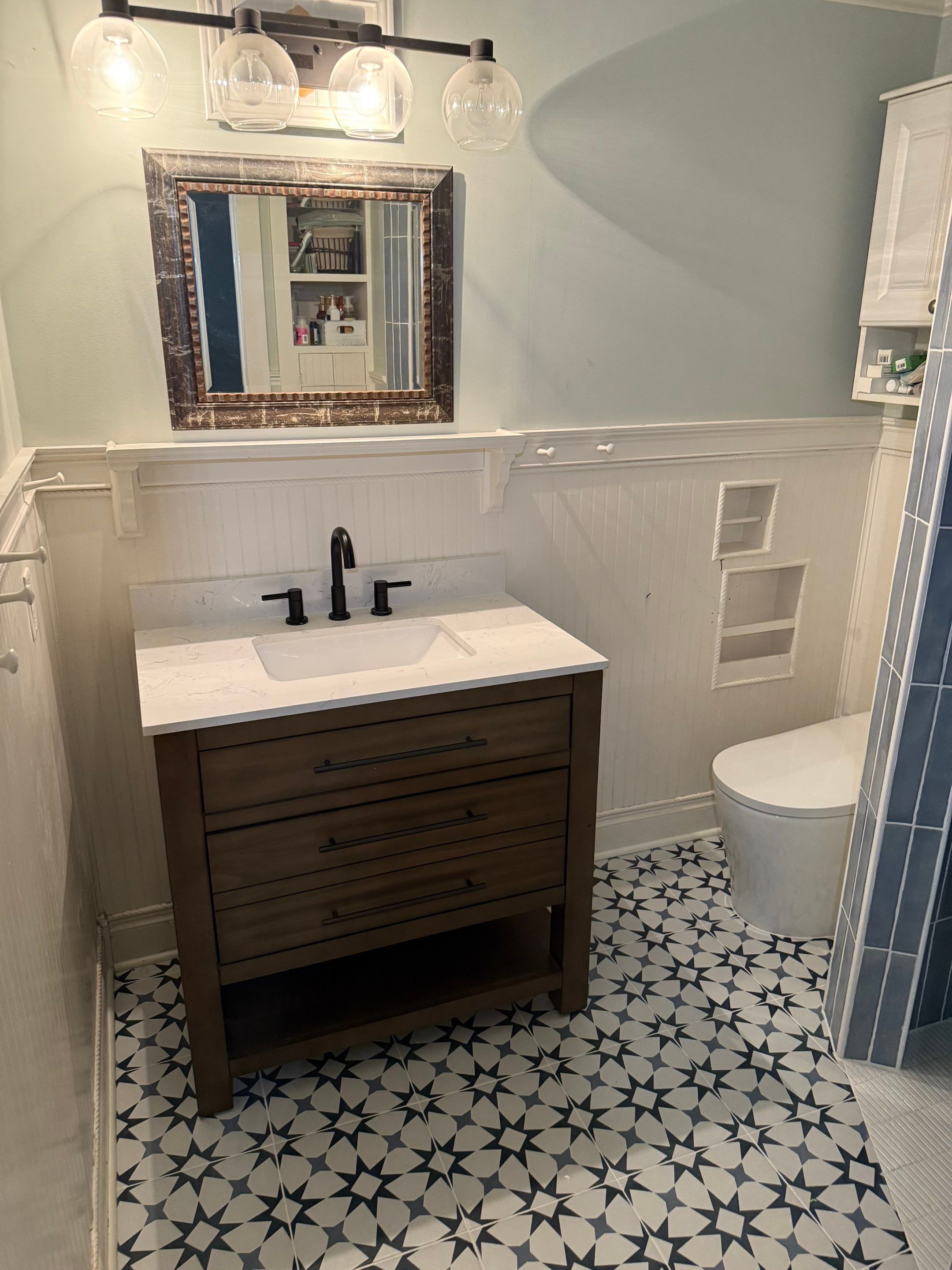 Tile shower and floor by Footprints Floors of Nashville