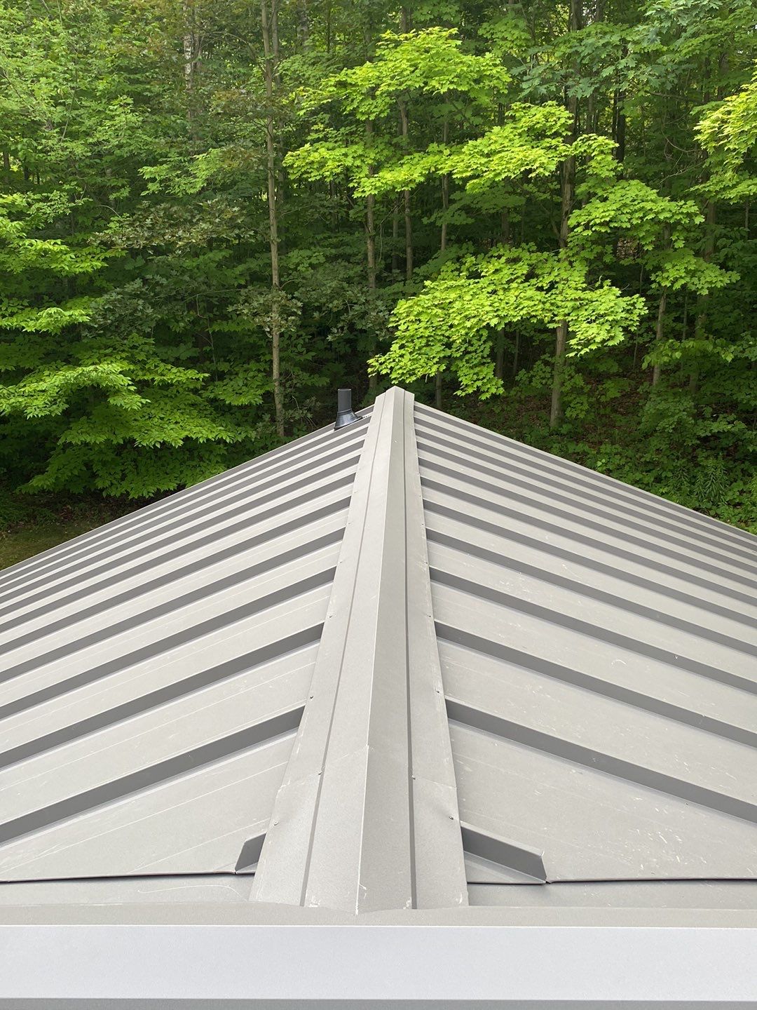 Residential Roofing Installation using 24 Ga Standing Seam Meta by Jay Carter Roofing & Sheet Metal
