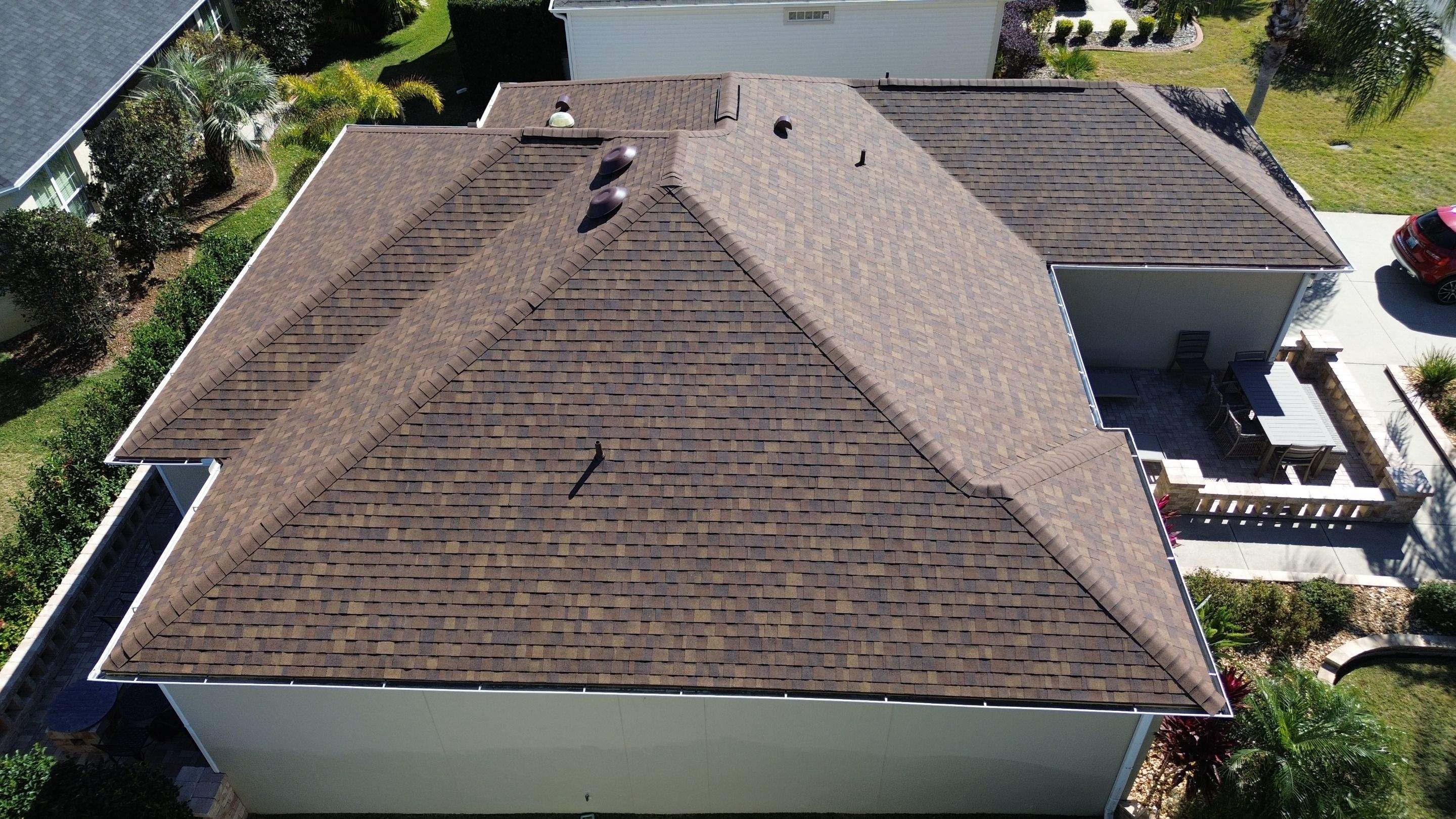 Florida roofers installing shingles by Brehm Roofing
