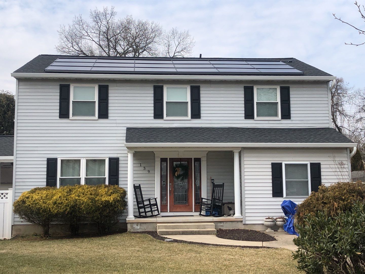 Roof Replacement with GAF Decotech integrated solar panels by American Home Contractors