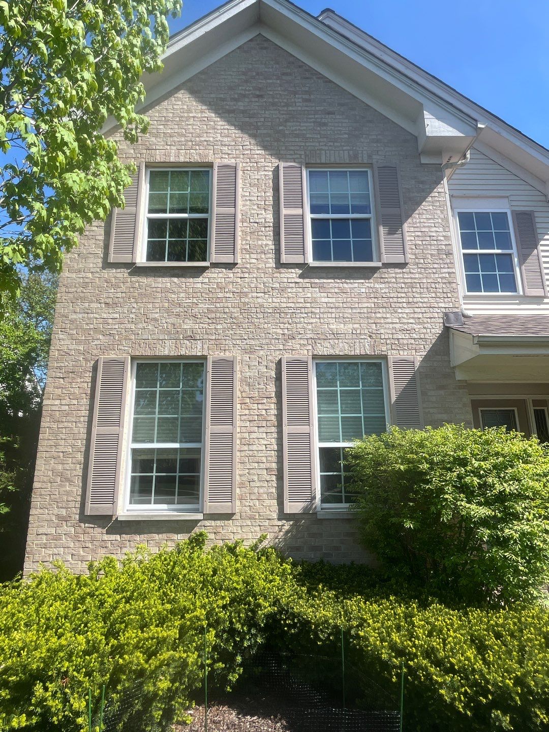 Housewashing  using Algaecide, soft wash soap by Northern Power Washing LLC.