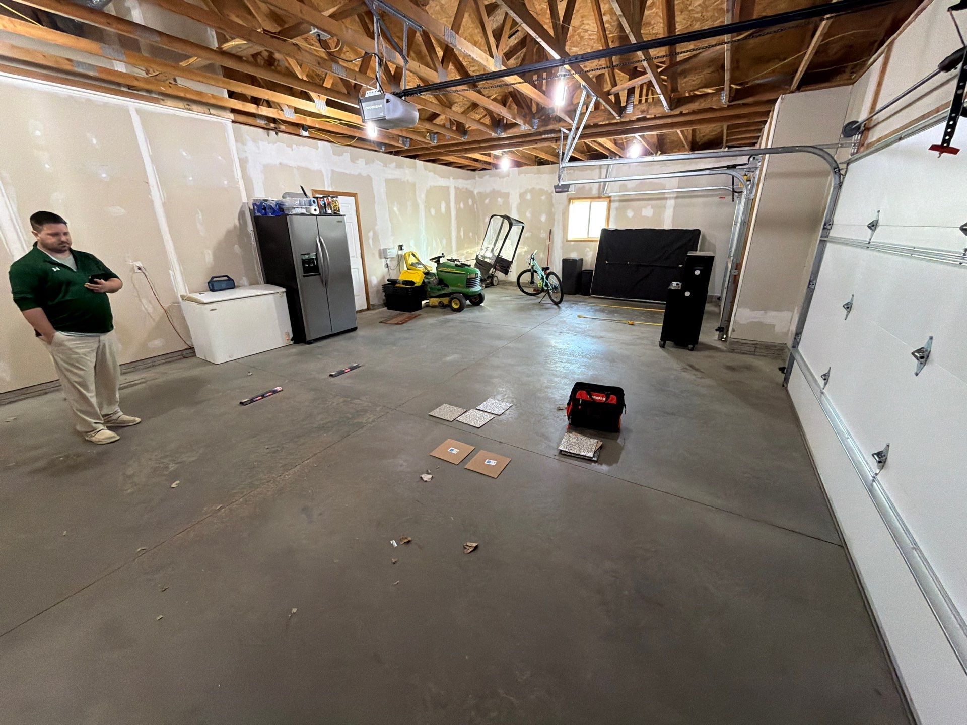 Tidal Wave Flake Garage Floor Installation in Sioux Falls by Select Painting, Coatings & Garage Cabinets