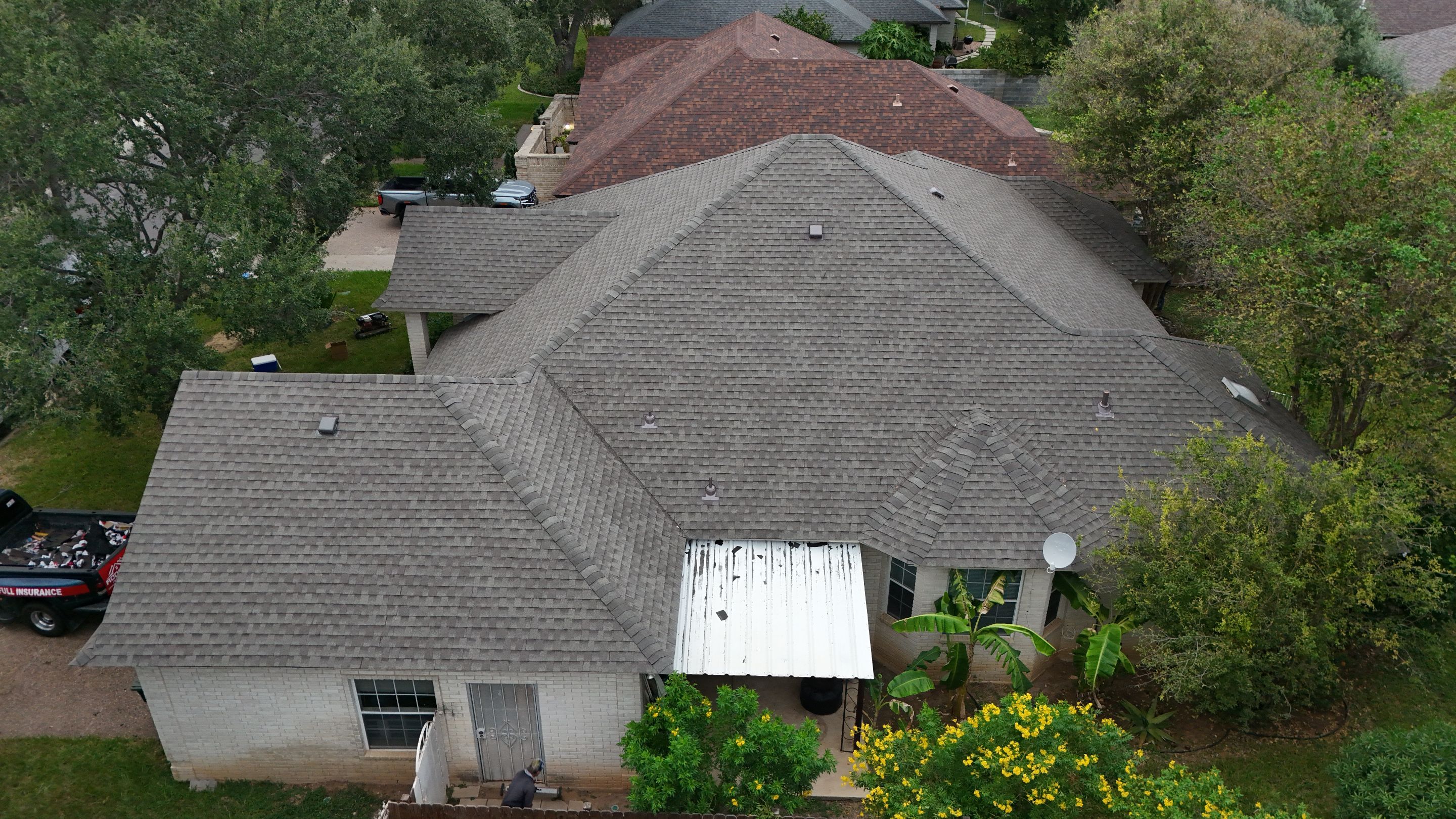 Residential Roof Replacement with Gray Composite Asphalt Shingles in Laredo by JM Flores Roofing & Construction, Inc