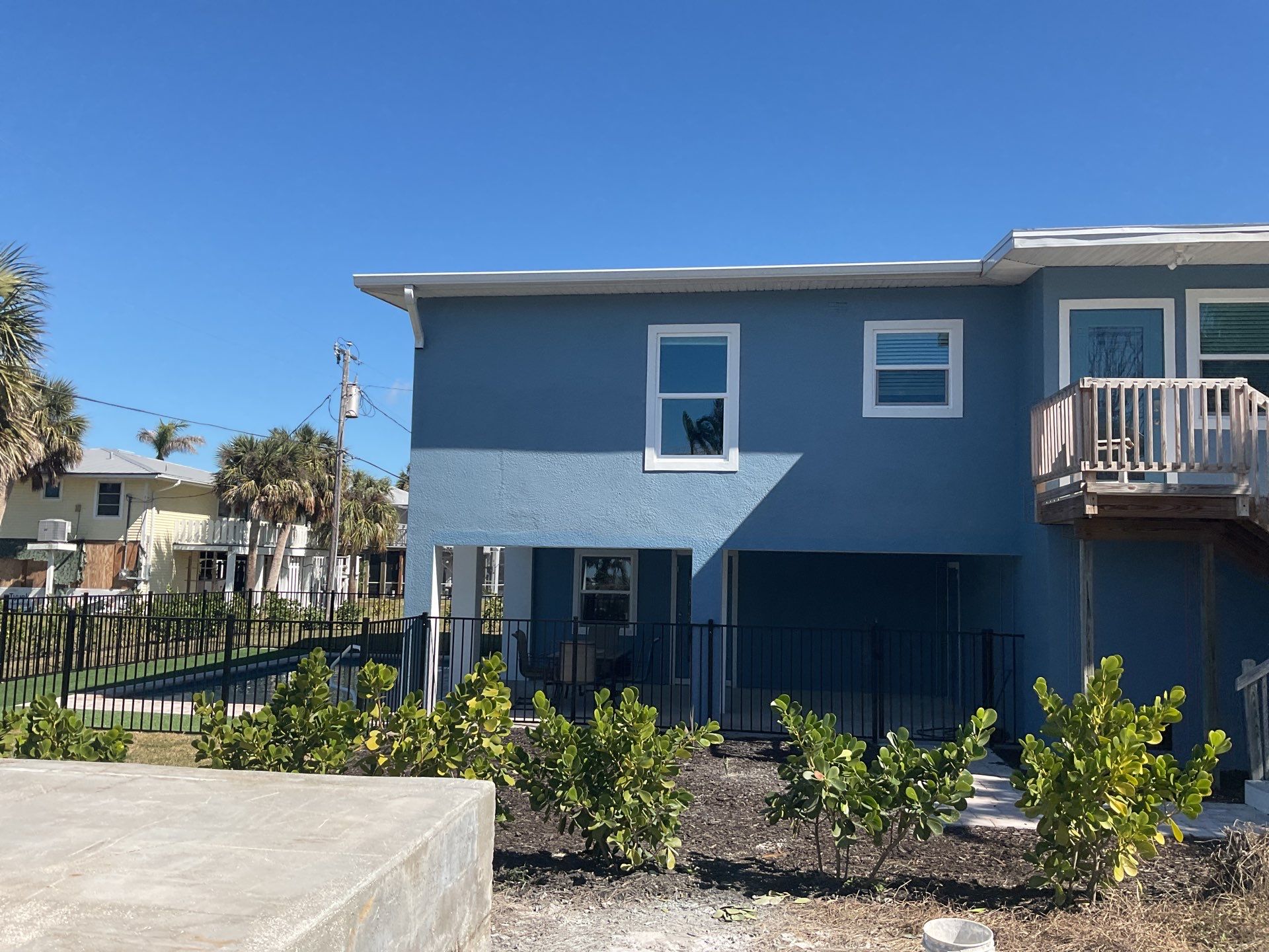 Downspout Installation for Two-Story Home in Fort Myers FL by Gutter Professor by Gutter Professors