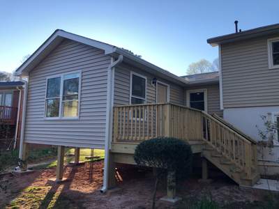 Sunroom Addition and Custom Wood Deck Installation in Marietta