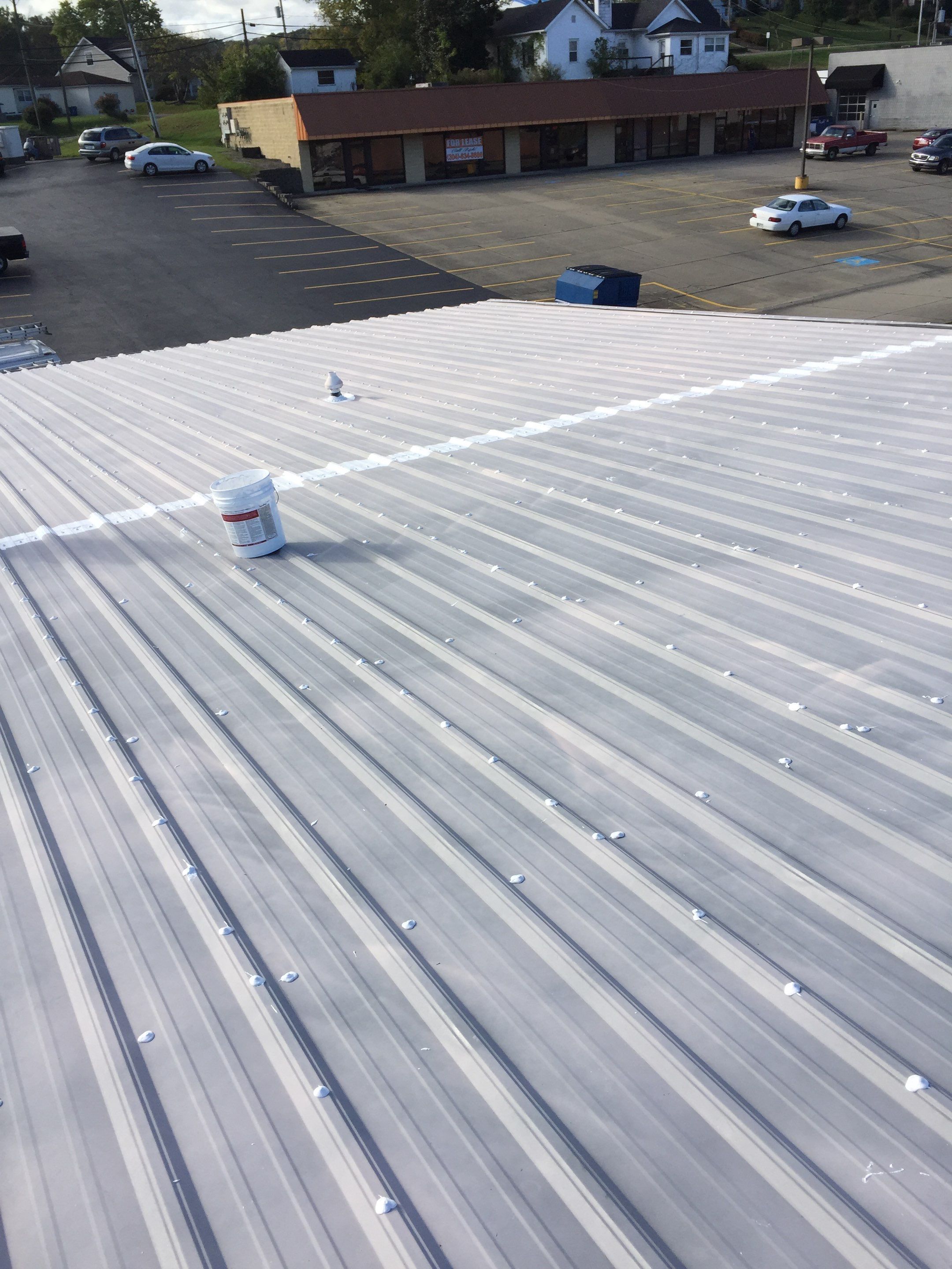 Commercial Roof Coating using Gaco Silicone Roof Coating by Secure Construction Company Inc