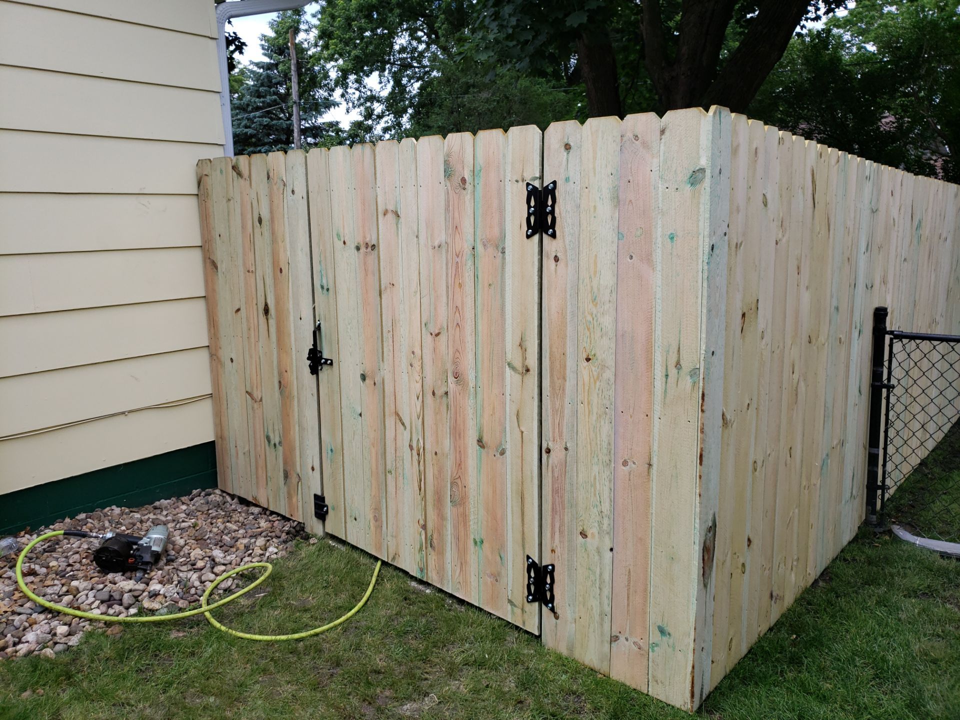 Custom Wood Privacy Fence Installation for Charles City Backyard by Perfect Picket Fence and Stain